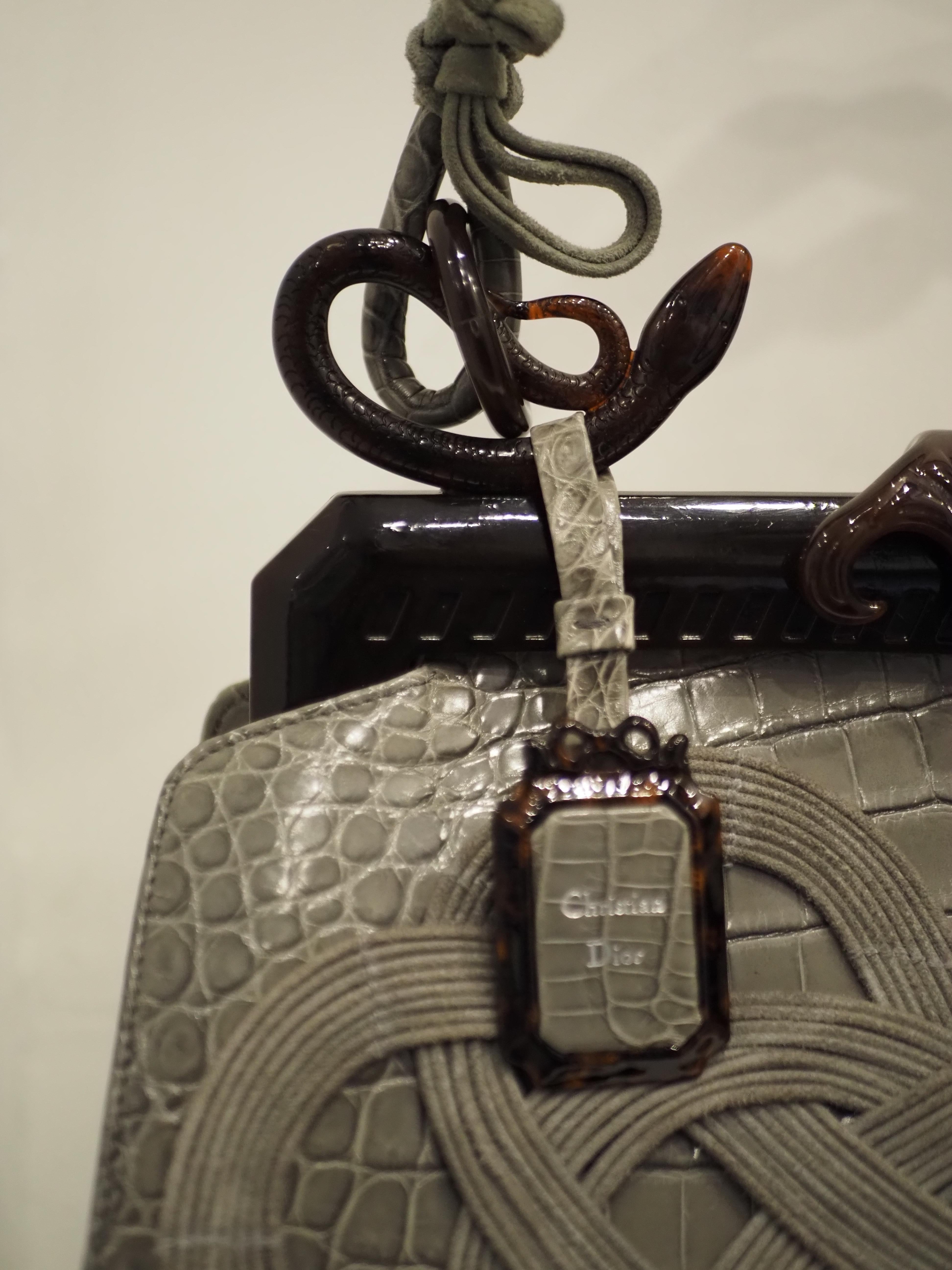 Christian Dior by Galliano Samourai Limited Edition bag NWOT
Christian Dior grey croco leather samourai handle bag NWOT
totally made with grey croco leather and bakelite hardware
Designed by John Galliano for the 60th anniversary of Dior. Comprised