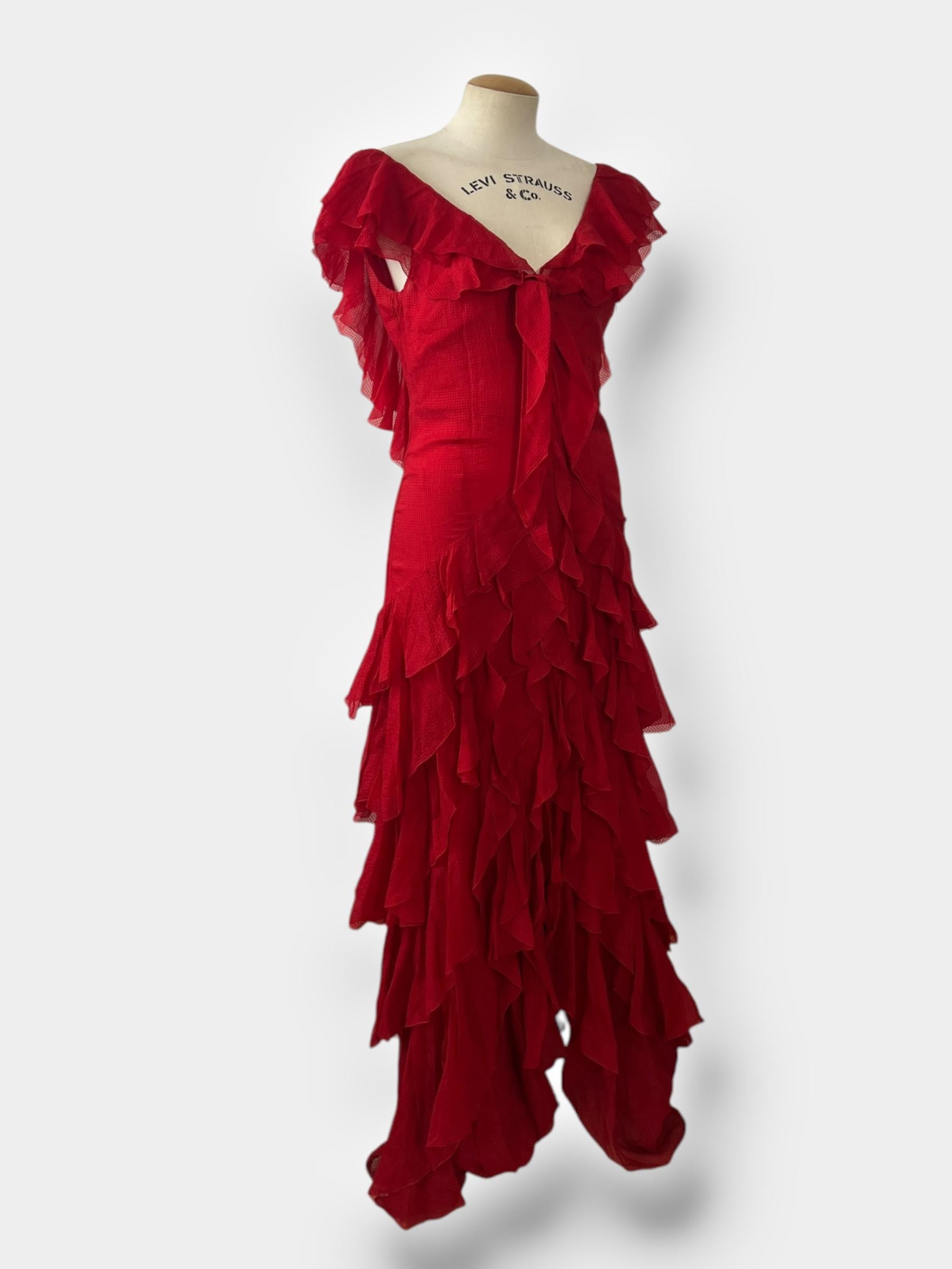 Step into a piece of 1990s fashion history with this elegant Christian Dior gown from the Gianfranco Ferré era. Meticulously crafted in 100% silk, this gown embodies the sophisticated, architectural aesthetic that defined Ferré's work during his