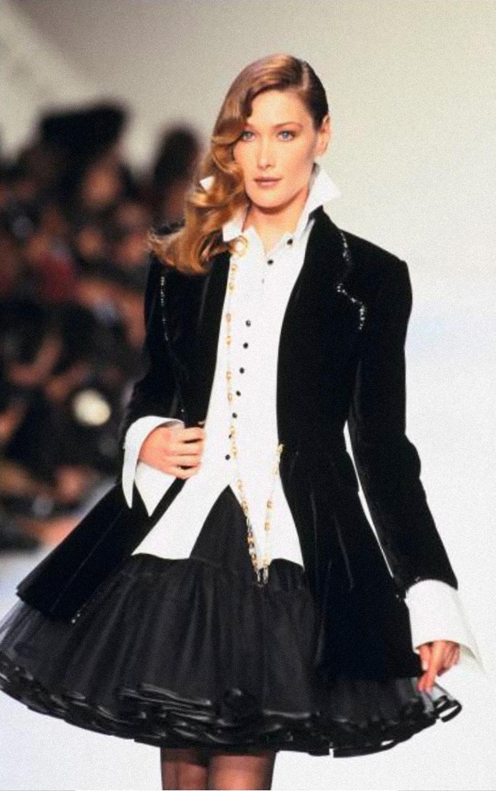 Christian Dior by Gianfranco Ferre, FW 1994 Collection, numbered archival piece. Documented and famously worn by Carla Bruni on the Runway.

From the illustrious atelier of Christian Dior comes a masterpiece of the Fall Winter 1994 Collection,