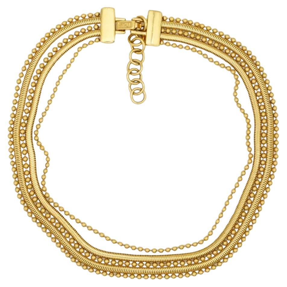 CHRISTIAN DIOR by John Galliano 1997 Vintage Masai Beads Coil 5 Five Strands Layers Chunky Statement Modernist Necklace, Gold Tone

Very excellent condition. 100% Genuine. Very rare to find.

Marked 'Dior (C) ' at clasp. 

Material: Gold plated
