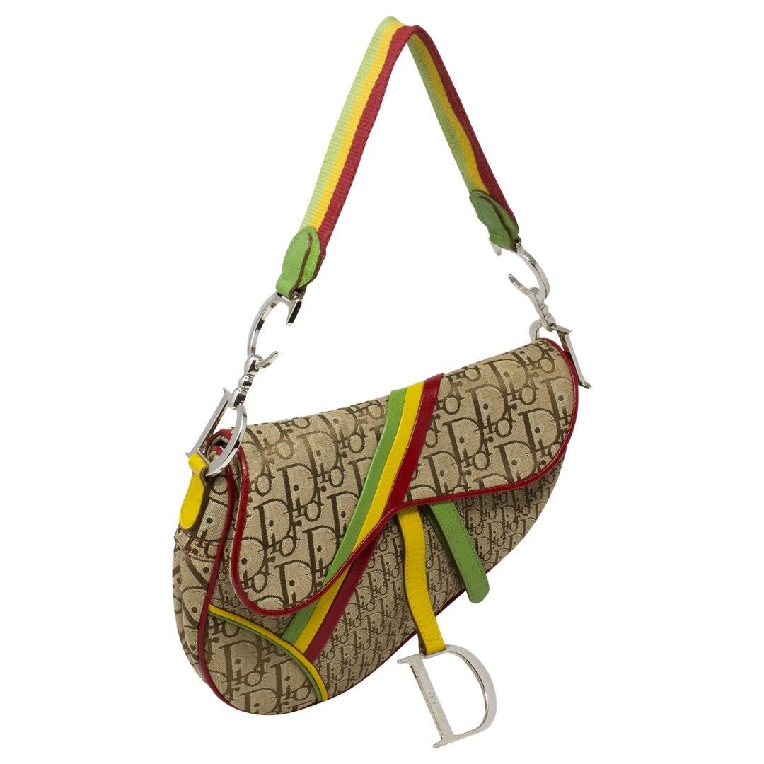 ONE OF THE MOST SOUGHT AFTER SADDLE BAGS!

Yes, we got our hands on this nearly pristine ICON! From the Christian Dior 2004 Collection by John Galliano, this beauty needs no introduction...crafted in brown Diorissimo Rasta canvas, with silver-tone