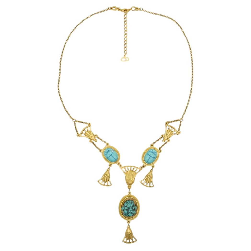 CHRISTIAN DIOR by John Galliano 2004 Egyptian Revival Turquoise Scarab Chandelier Fans Long Necklace, Gold Tone

Very good condition. The largest oval pendant has been changed to a turquoise. 100% Genuine. 

The token appears to have been added at a