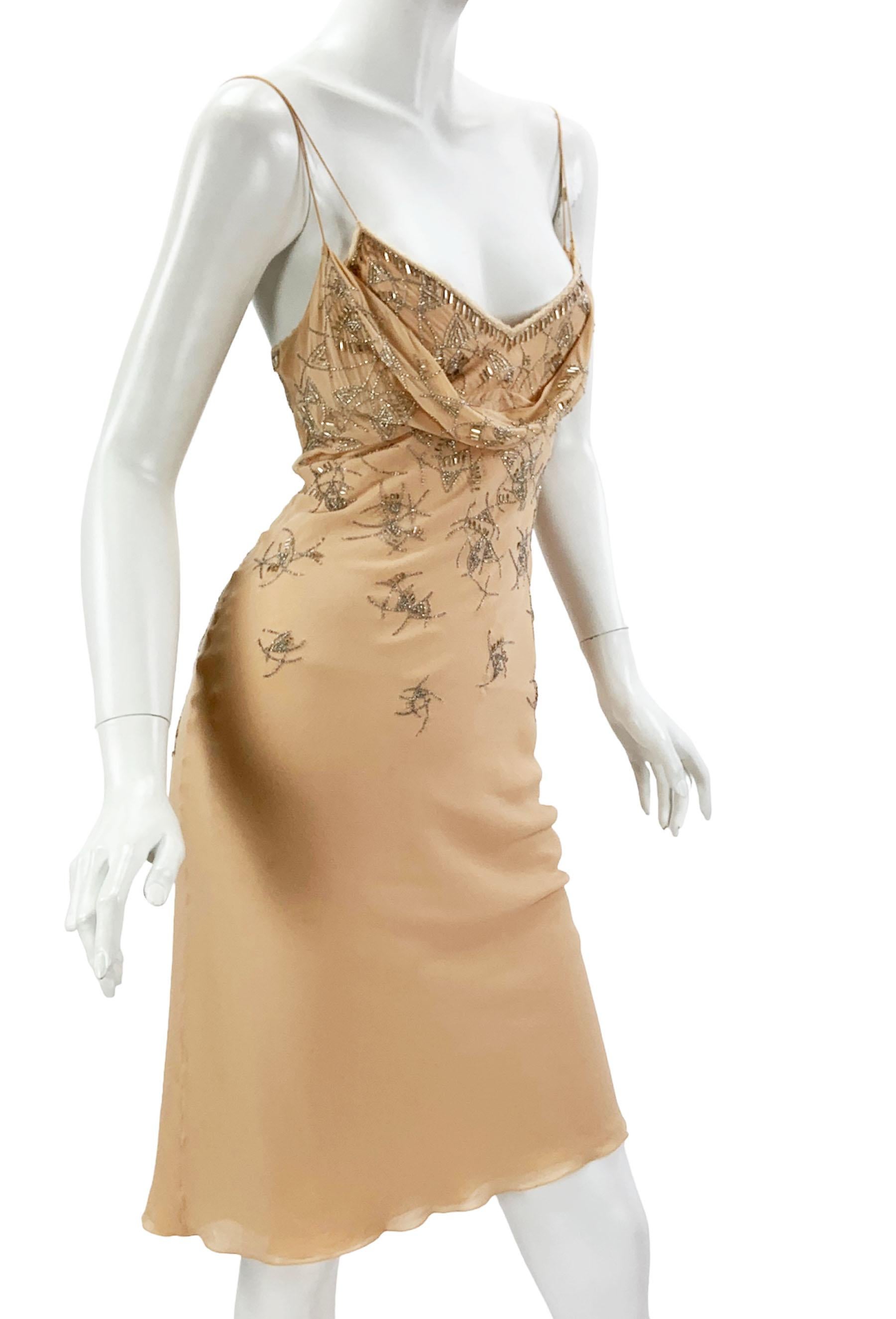 Vintage Christian Dior by John Galliano Silk Embellished Dress
2005 Collection
French size 42 ( US 4 )
Silver tone beads over the beige silk, Signature Galliano little buttons closure, Spaghetti straps, Cowl neckline, Fully lined, Bias cut.
Size