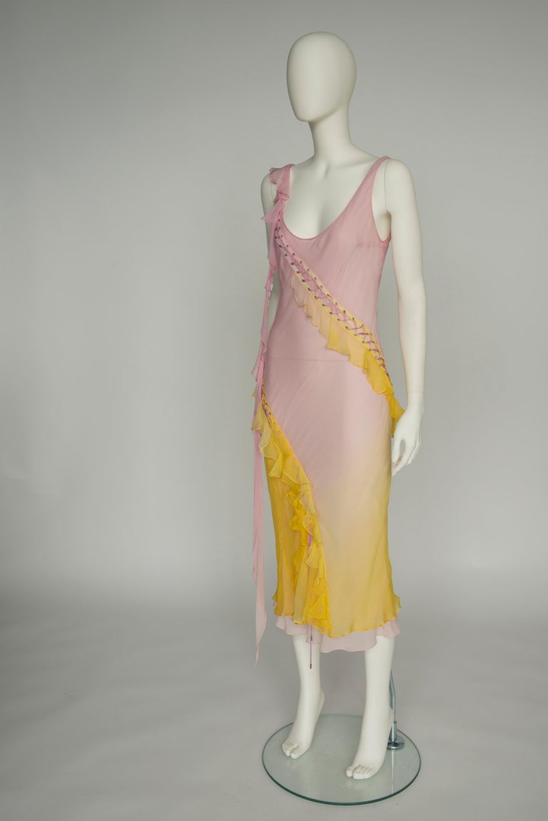 An emblematic early 2000s Galliano silhouette, this Spring-Summer 2004 Christian Dior dress is made from weightless silk-chiffon which is lined with a first (longer) layer to temper the sheerness. Lace-up detailing is to be found throughout the