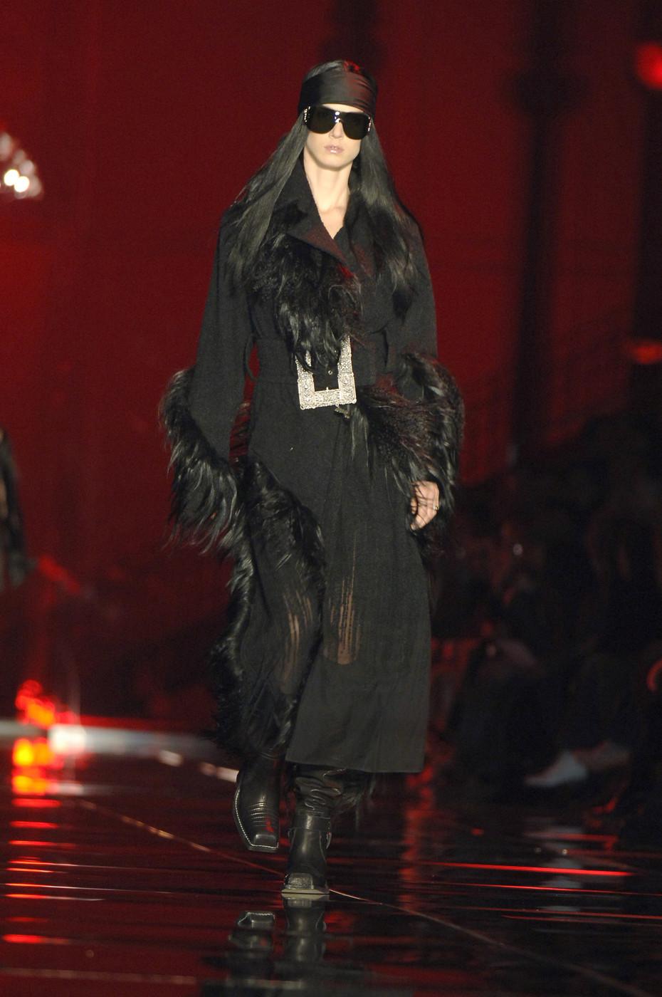 Christian Dior by John Galliano black boucle maxi coat with yak and Mongolian lamb. Gradient design - the fabric descends into silk organza towards the hem. 

Fall-Winter 2006