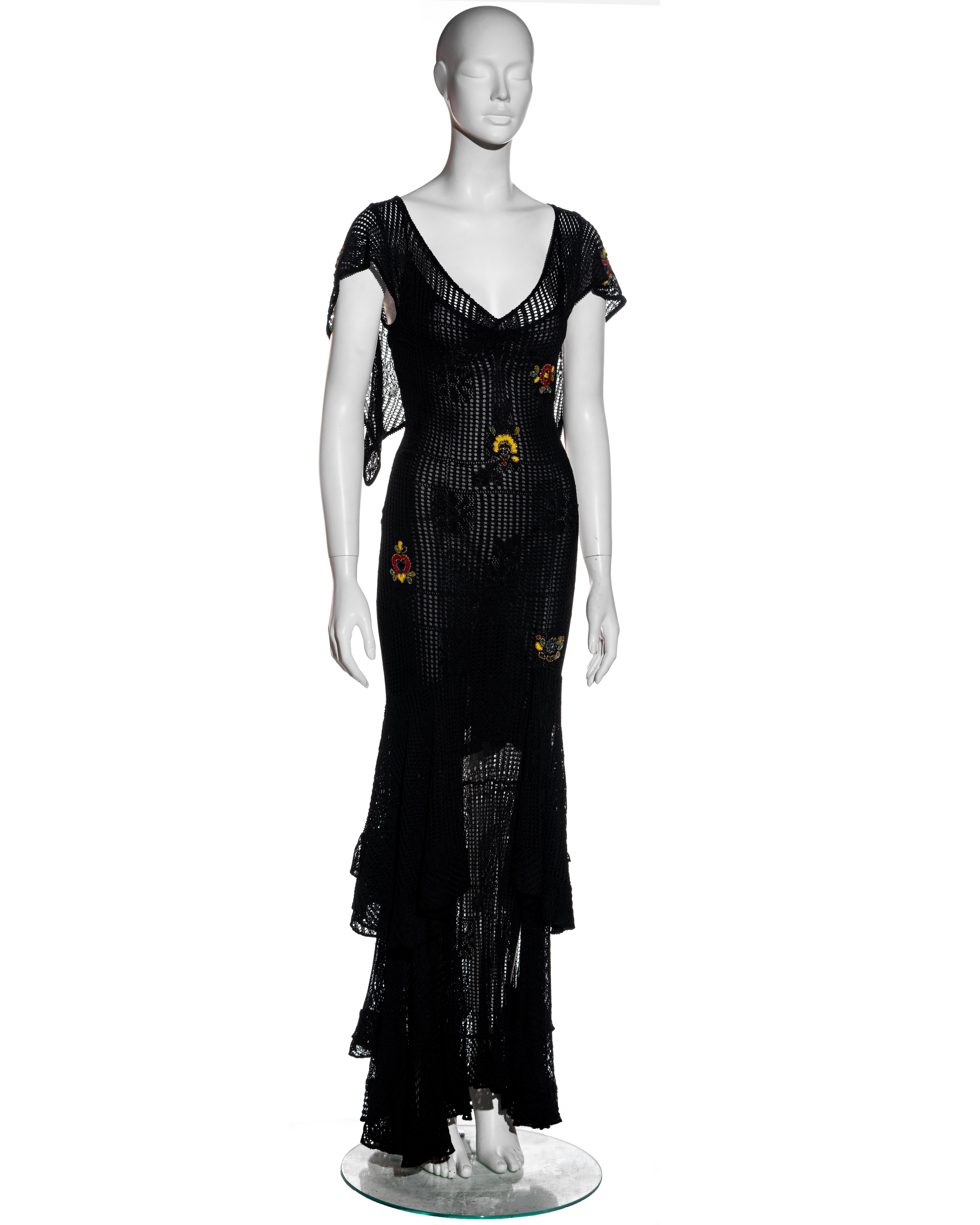 ▪ Christian Dior black crochet maxi dress
▪ Designed by John Galliano 
▪ Tiered maxi skirt 
▪ Hanging panels at the shoulders 
▪ Beaded chenille appliques 
▪ Attached slip dress 
▪ FR 40 - UK 12 - US 8
▪ Fall-Winter 2001