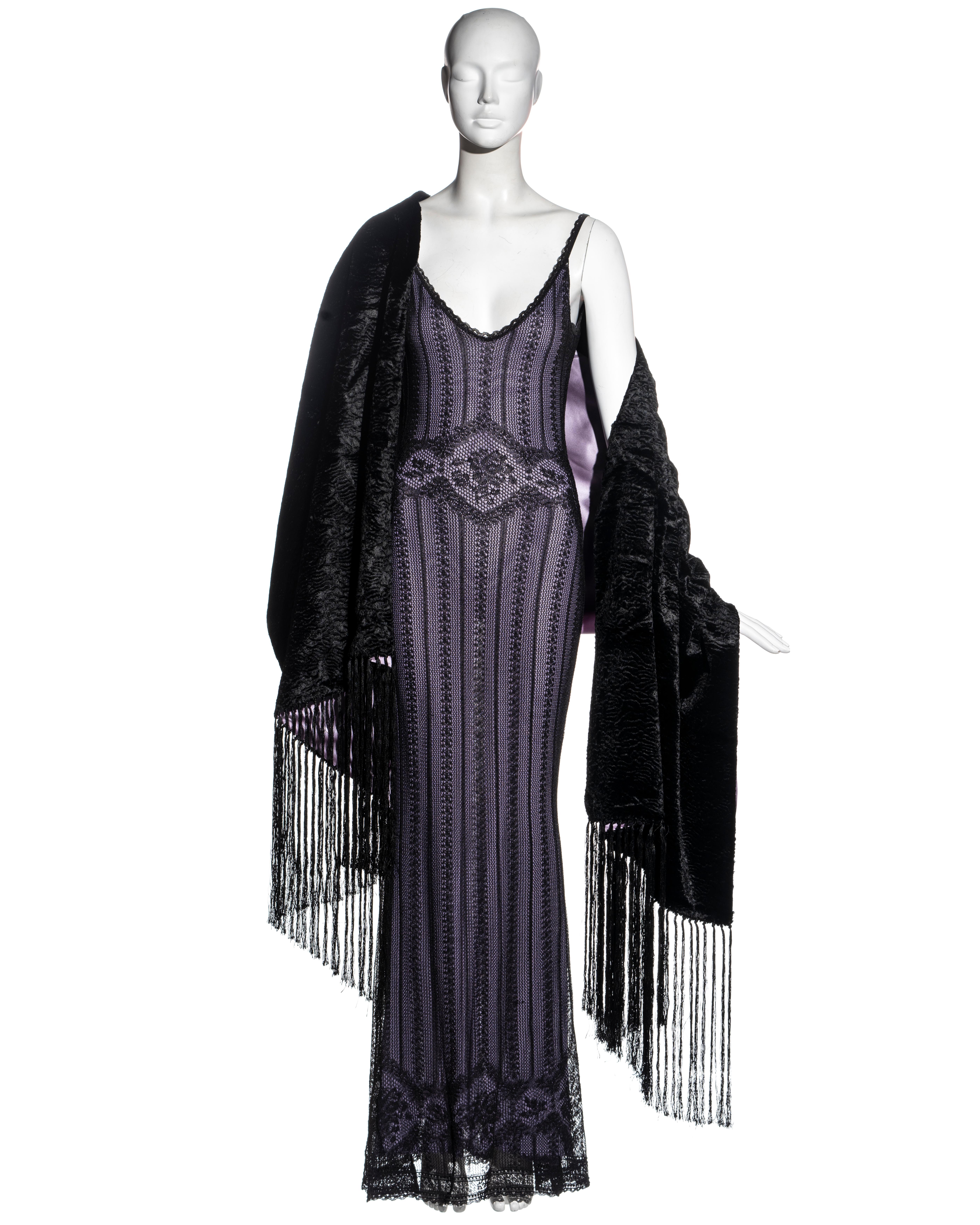 ▪ Christian Dior black lace floor-length evening dress
▪ Designed by John Galliano 
▪ Double-layered 
▪ Fine knitted lace
▪ Purple viscose-knit underdress 
▪ Large faux astrakhan shawl with tassels and purple silk lining 
▪ Size Small
▪ Fall-Winter