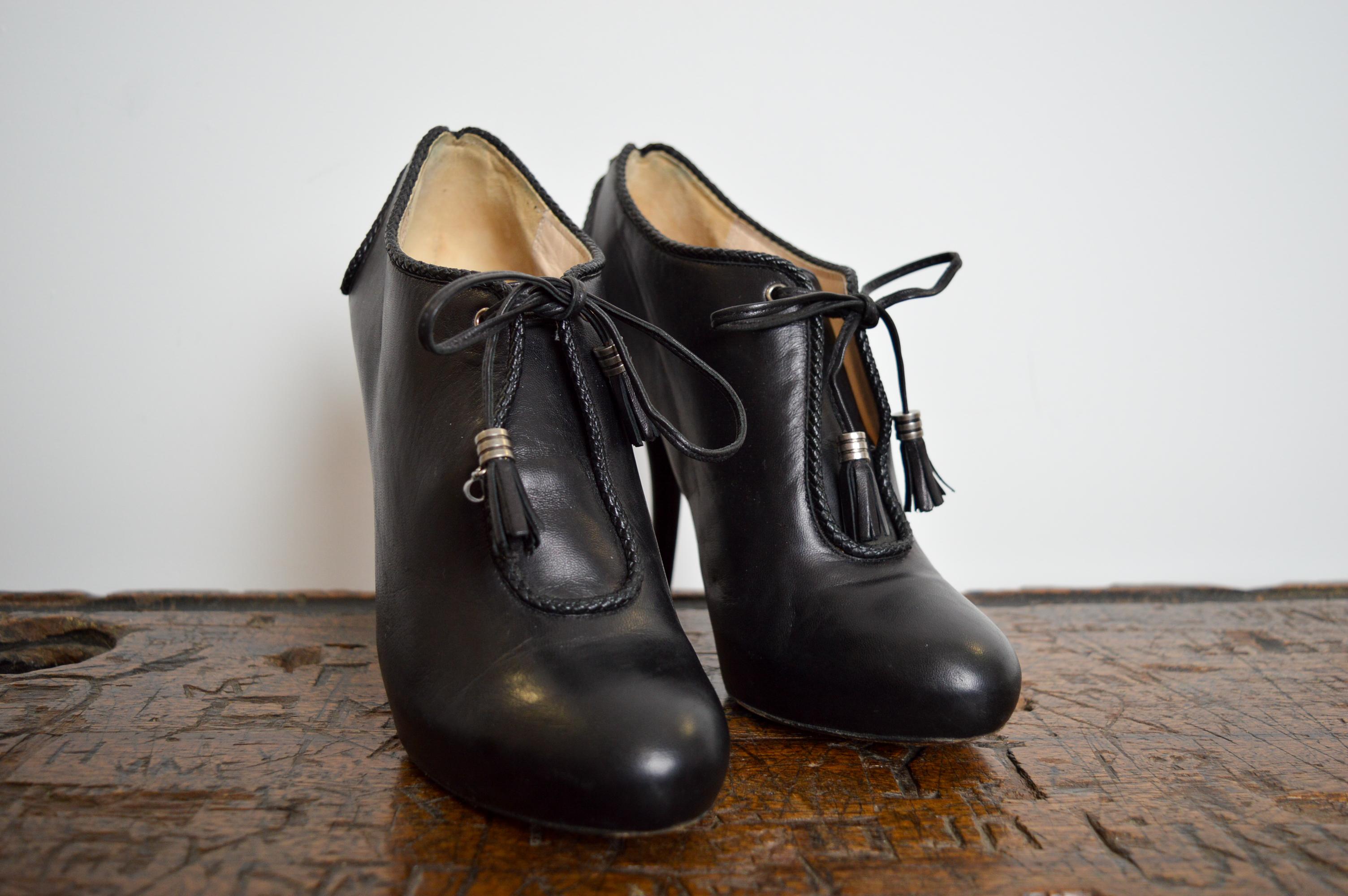 Beautiful Christian Dior by John Galliano Black Ornate Leather Runway, lace Up ankle Shoes - High Heels  
MADE IN ITALY.
Leather Soles
Intricate Braid work detail 
Tasseled leather Laces with ‘C’ & ‘D’ charms
U.K. Size 4.5 / EU Size 37
Heel height :