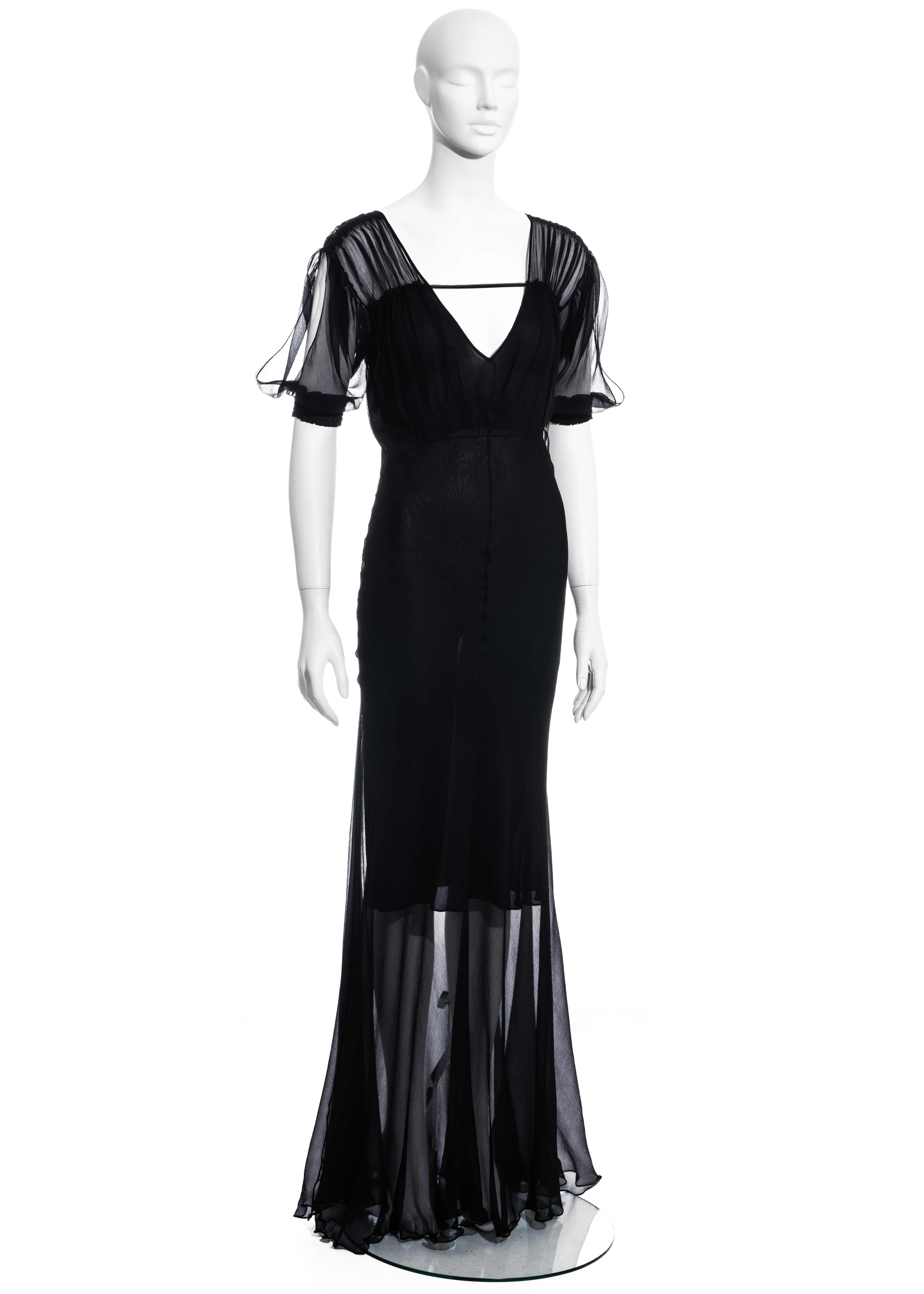 ▪ Christian Dior black chiffon evening dress
▪ Designed by John Galliano
▪ 100% Silk
▪ Puff sleeves with slits 
▪ V-neck 
▪ FR 40 - UK 12 - US 8
▪ Spring-Summer 2002
