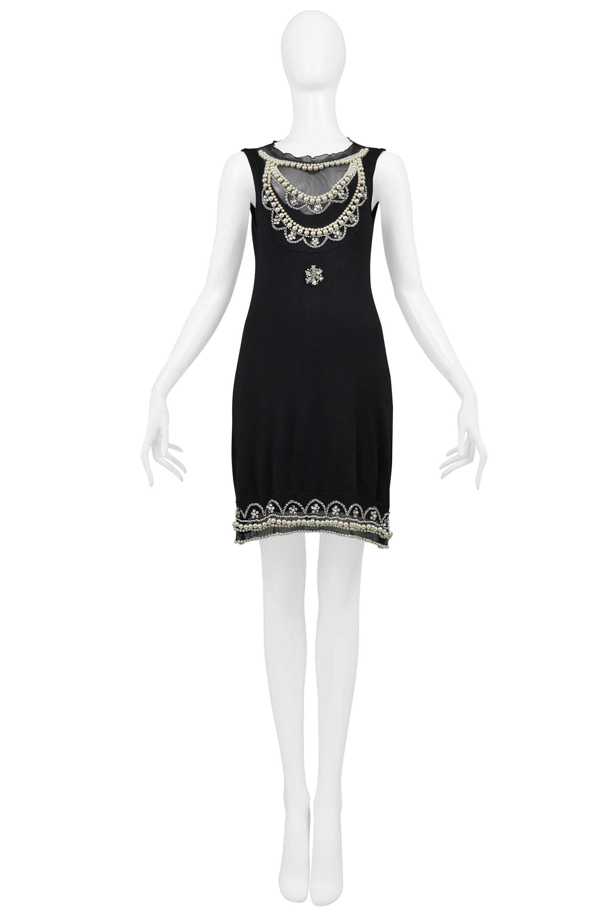 Resurrection Vintage is excited to offer a vintage Christian Dior by John Galliano black knit tank dress featuring pearls and clear rhinestones at the neckline, center front and hem, mesh inset at front bodice and back yoke, back keyhole with button