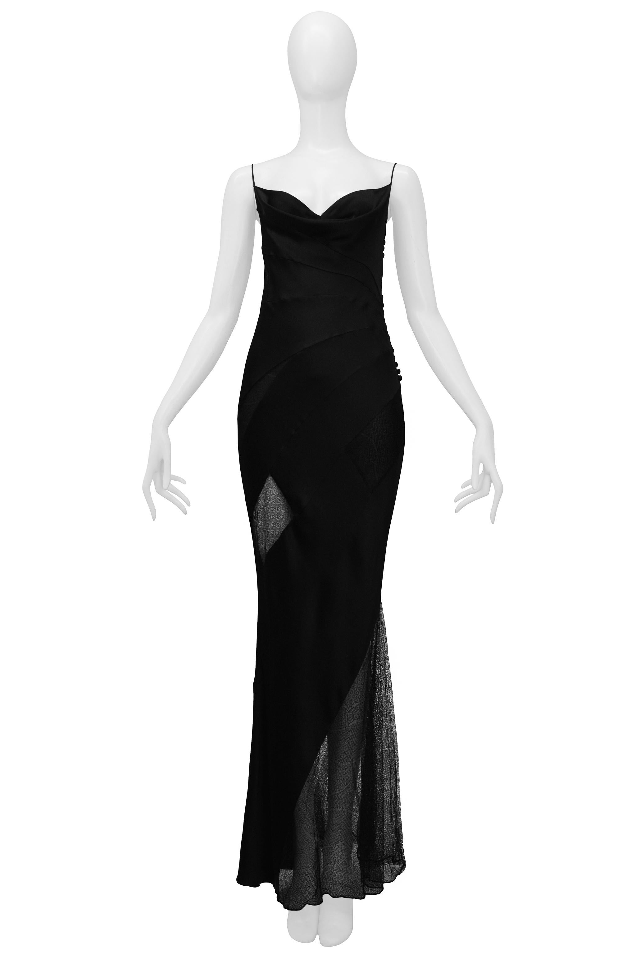 Resurrection is excited to offer this vintage Christian Dior black evening gown featuring lace insets, spaghetti straps, asymmetrical sheer mesh side skirt panel, and side button closure.

Christian Dior Paris
Designed by John Galliano
Size 40
Silk