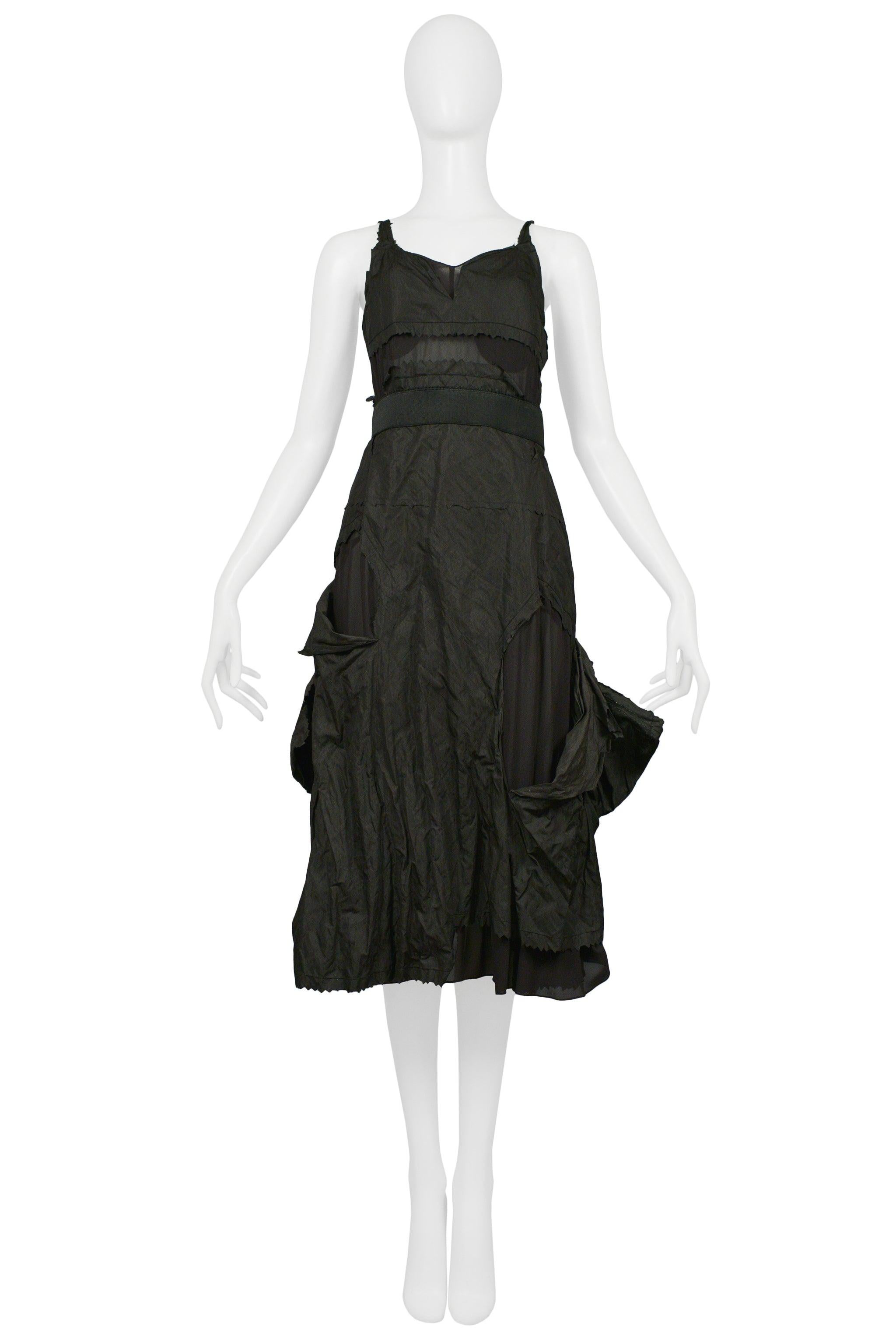 Resurrection is excited to offer this vintage Christian Dior by John Galliano black taffeta hobo style slip dress featuring cutouts, tattered panels, skinny straps, bra bodies, sheer panels, low back, and raw edges.

Christian Dior