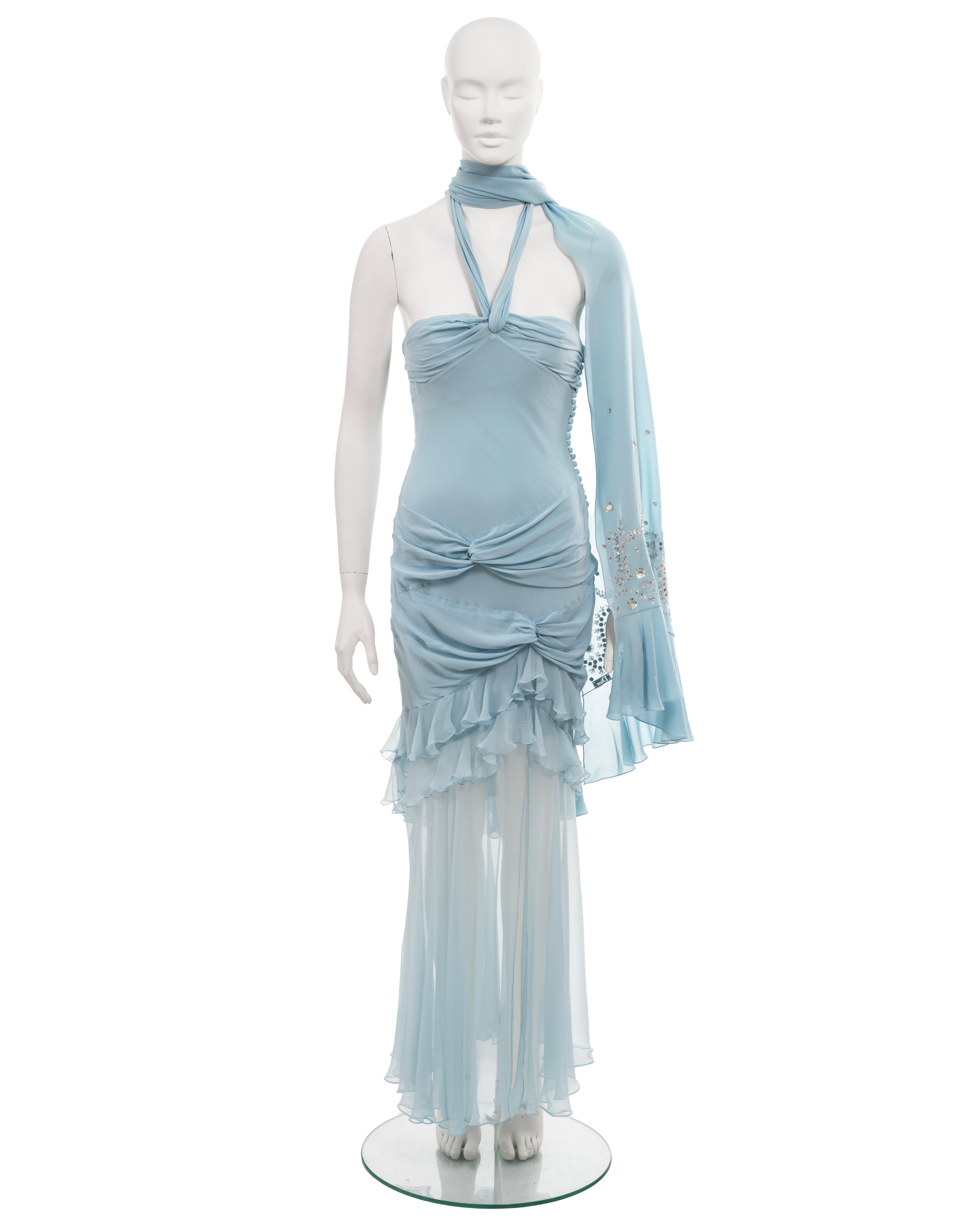 ▪ Christian Dior evening dress 
▪ Creative Director: John Galliano 
▪ Spring-Summer 2004
▪ Sold by One of a Kind Archive 
▪ Pale blue silk chiffon  
▪ Halterneck  
▪ Drapes at the chest and hips  
▪ Built-in cotton-tulle bra  
▪ Tiered ruffled skirt