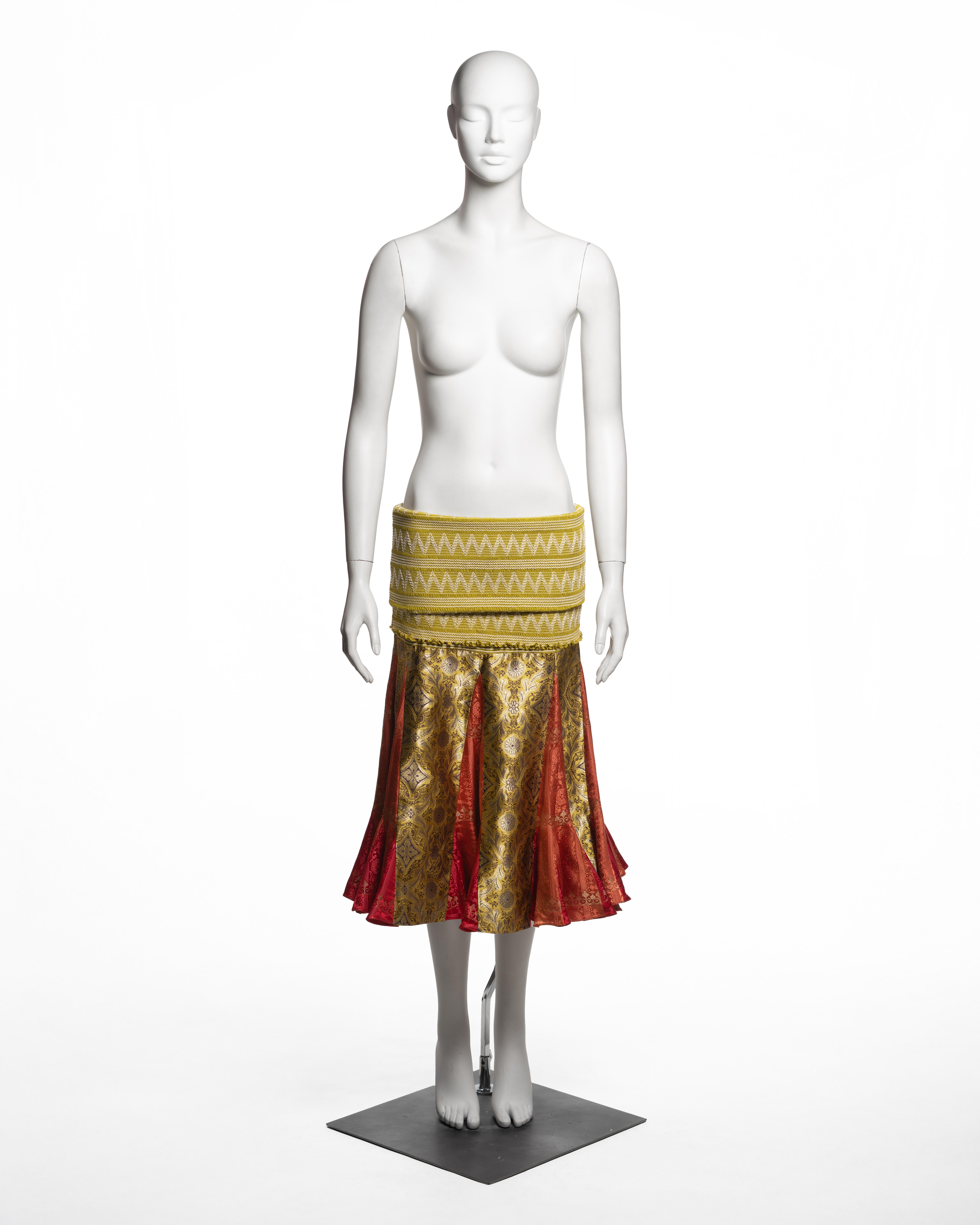 This Christian Dior by John Galliano skirt from the Fall-Winter 2002 collection is constructed with an elongated waistband in chartreuse, intricately smocked with horizontal rouleaux and zigzag embroidery in contrasting ivory thread. The waistband