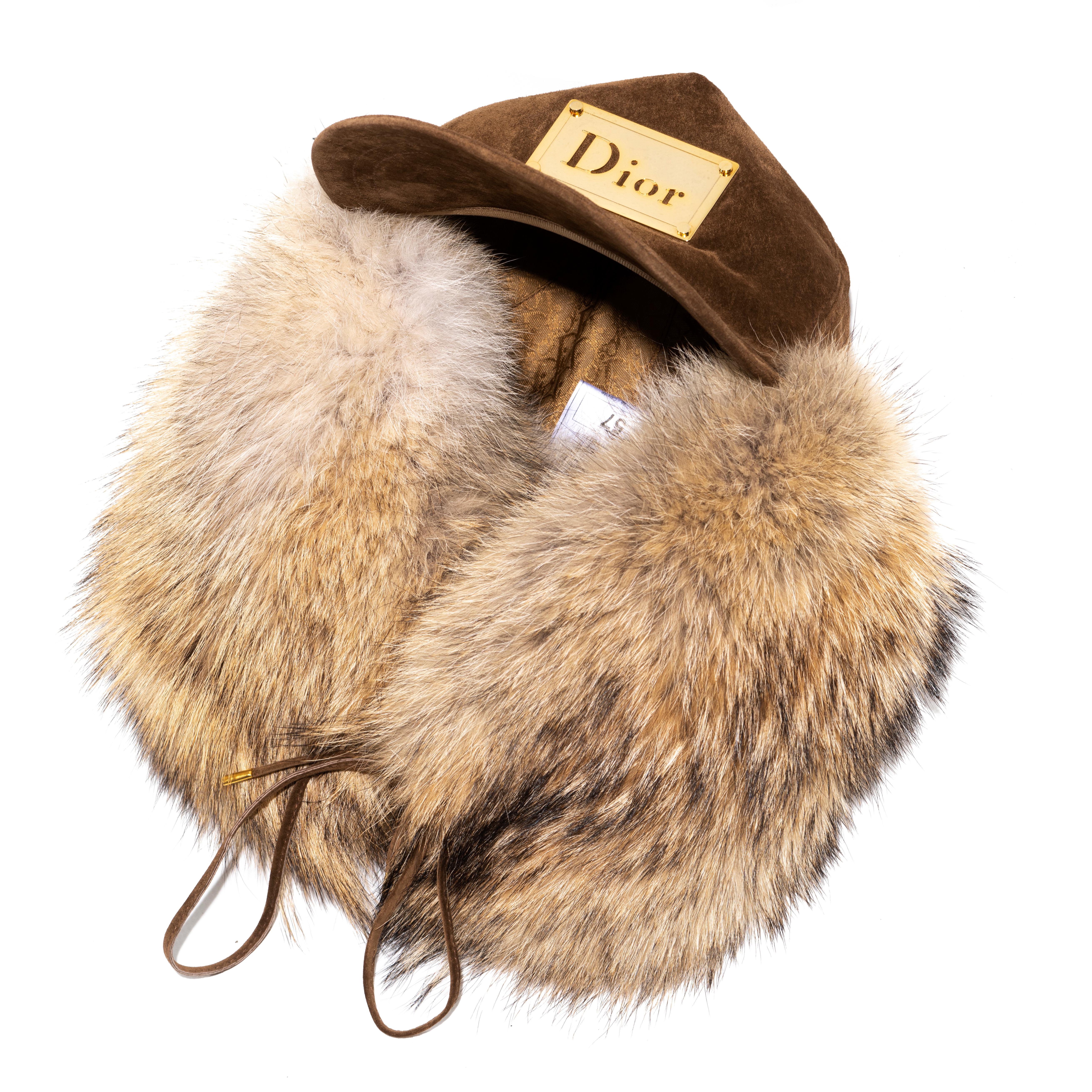 ▪ Christian Dior trapper hat 
▪ Designed by John Galliano
▪ Sold by One of a Kind Archive
▪ Constructed from brown leather pigskin and coyote fur 
▪ Gold-tone metal plate with Dior logo 
▪ Monogram lining 
▪ Size: 57
▪ Spring-Summer 2002
▪ Made in