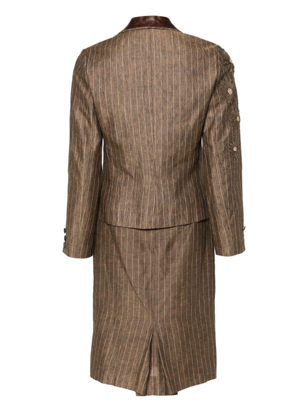 Christian Dior by John Galliano brown linen skirt suit featuring a jacket with floral appliqué, notched lapels with leather detail, silk lining with 