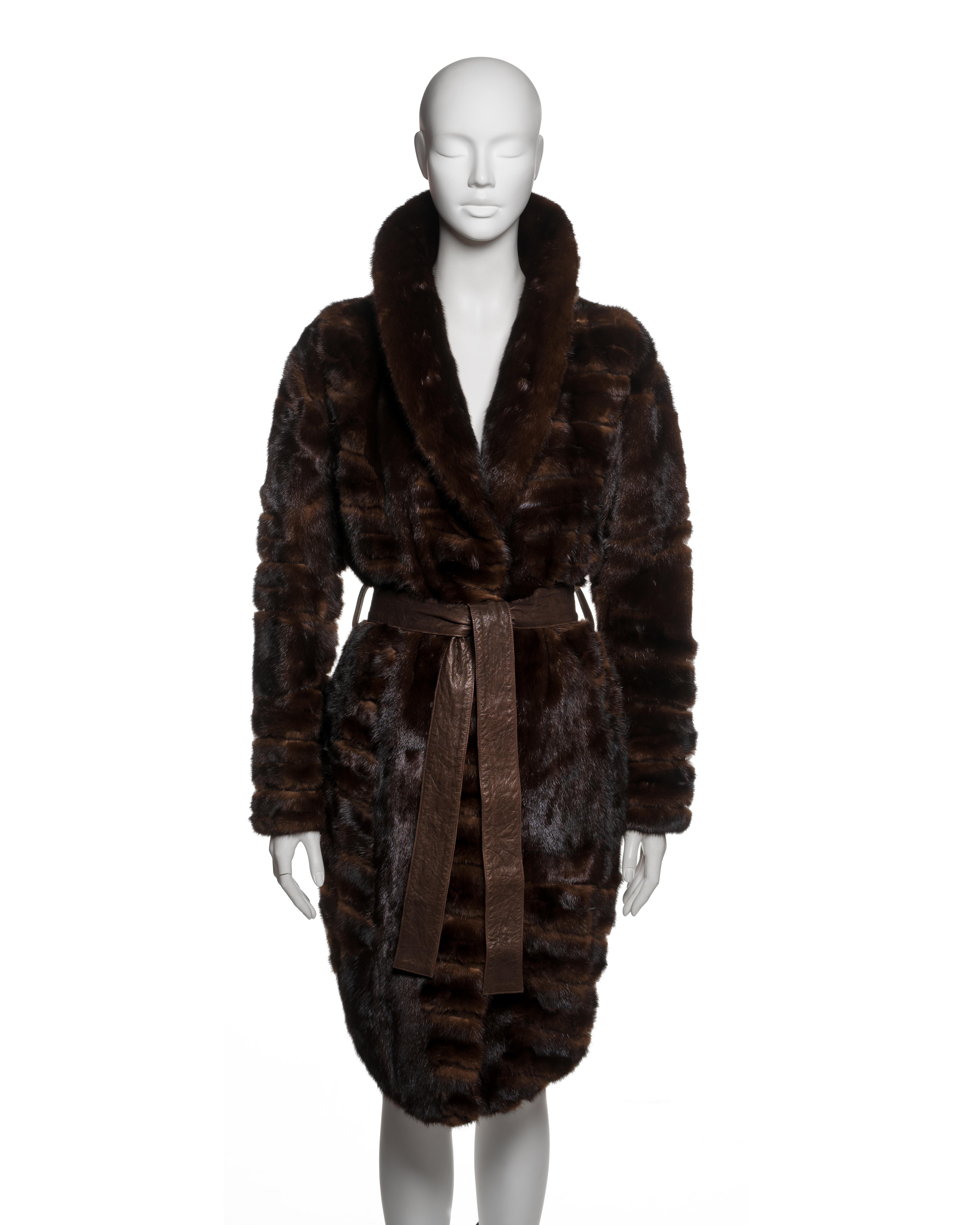 Christian Dior under John Galliano brown sheared mink coat from the Fall-Winter 2006 collection. The coat is constructed in horizontal panels of pelts with uniform shearing, enhancing the rich surface texture and natural lustre of the mink. Cut to a