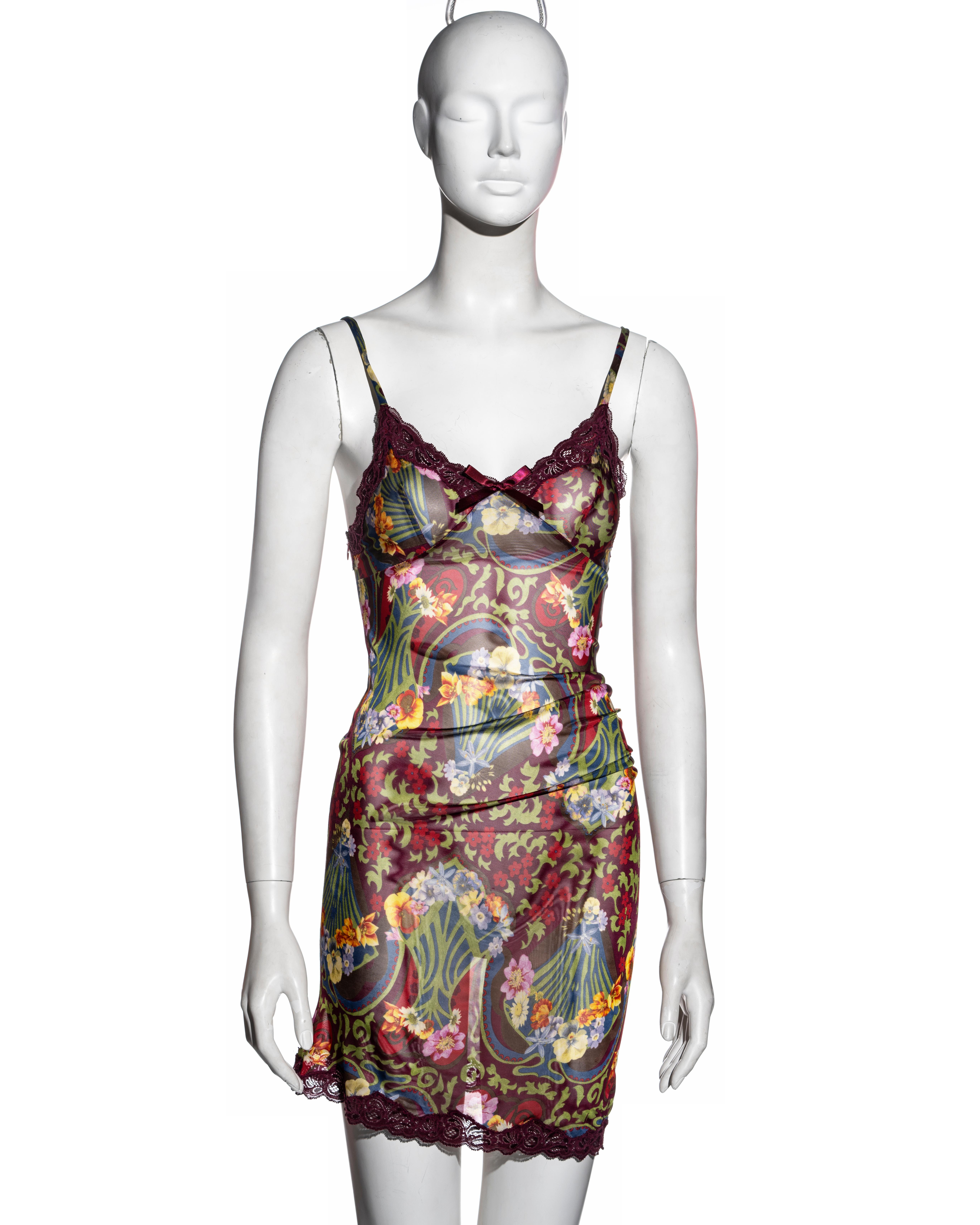 ▪ Christian Dior burgundy floral mini slip dress
▪ Designed by John Galliano
▪ Art Nouveau inspired floral print 
▪ Lace trim 
▪ Ribbon bow detail 
▪ Twisted cut allows the fabric to ruche at the waist and create an asymmetric hemline 
▪ FR 36 - UK
