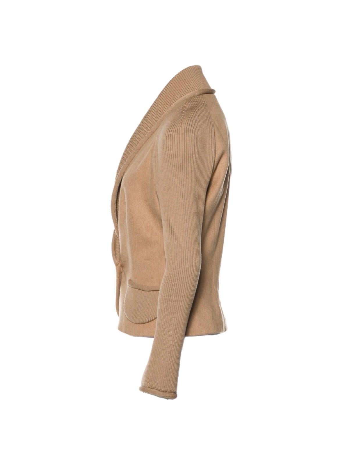 
Stunning piece designed by Christian Dior
Gorgeous jacket in a beautiful color  that matches everything
Made of finest camel hair combined with knit details
Two front pockets
Closes with front button
Beautiful silk lining, Dior „CD“ Initials