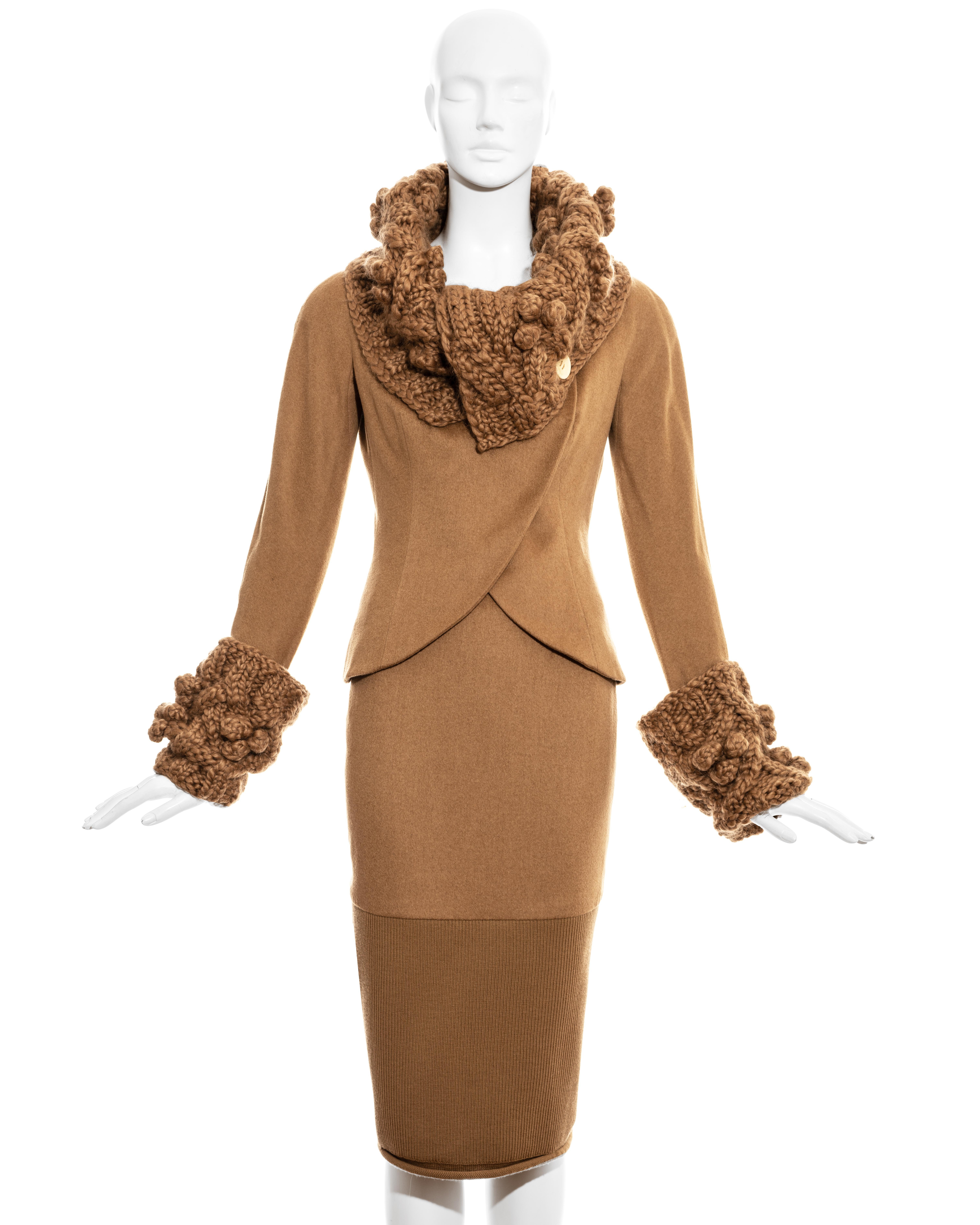 Christian Dior by John Galliano camel wool skirt suit comprising: fitted jacket with a chunky knitted collar and cuffs, and matching skirt with ribbed wool hem and large button back fastening. 

Fall-Winter 1999