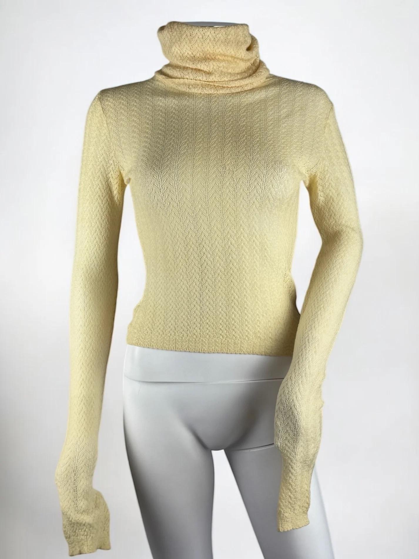 Christian Dior by John Galliano open-knit chevron jumper, Fall Winter 1998
Buttermilk pale yellow 
Similar versions appeared throughout runway
Exaggerated turtleneck
100% wool
Size: M