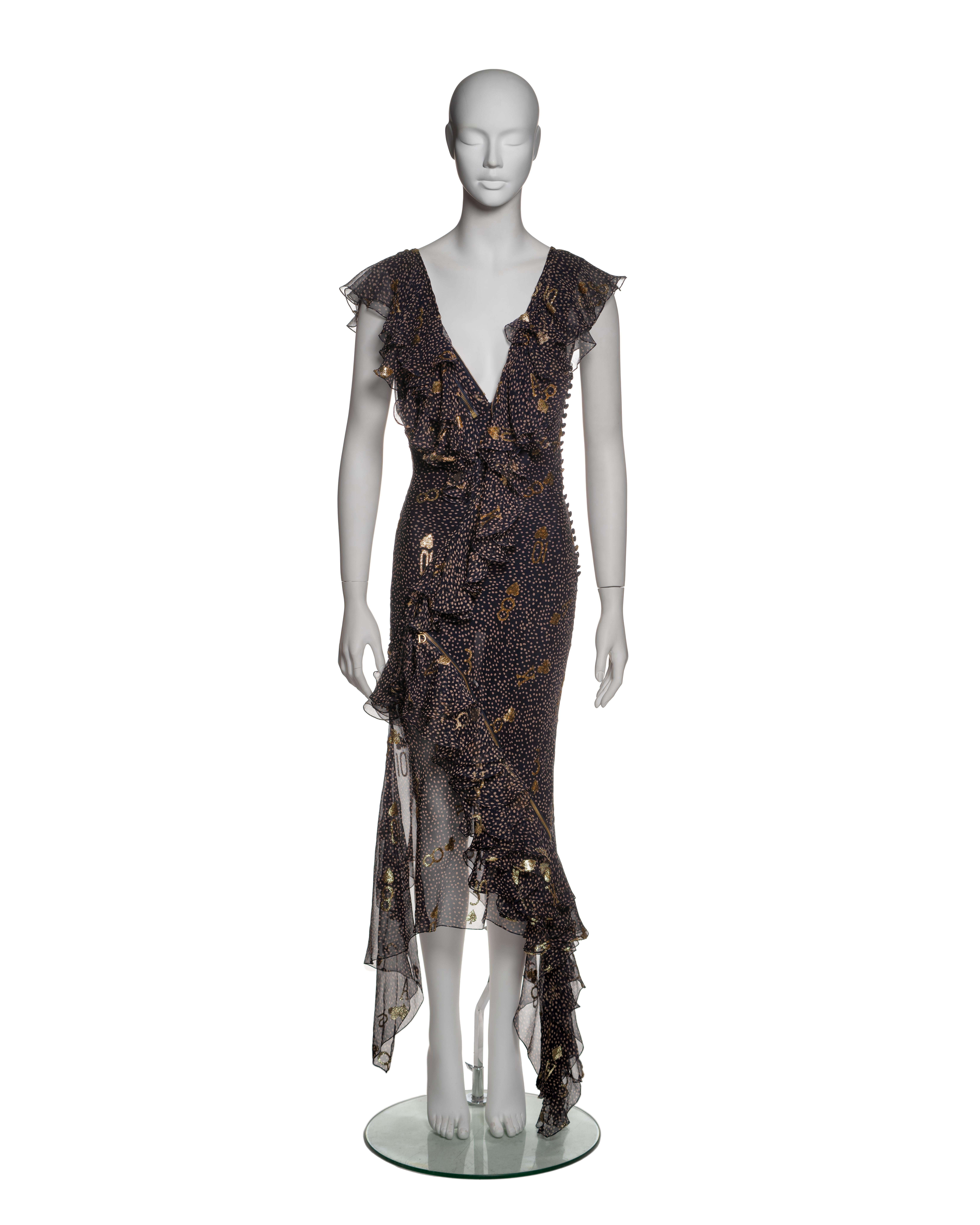 This Christian Dior dress from the Spring-Summer 2001 collection by John Galliano is crafted from lightweight navy chiffon, featuring a cream polka-dot print and adorned with gold metallic motifs reminiscent of playing card symbols, such as spades