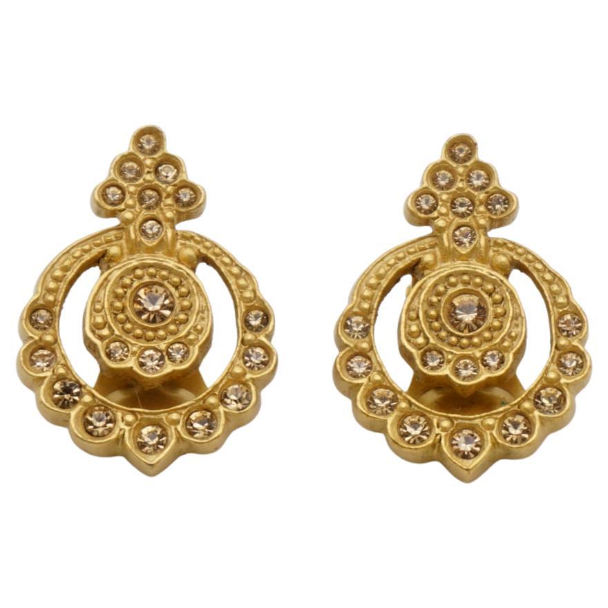 Christian Dior by John Galliano Vintage Baroque Double Circles Openwork Citrine Crystals Filigree Elegant Clip On Earrings, Gold Tone

Very excellent condition. Very new. 100% Genuine. 

Vintage and rare to find. Signed at the back.

Material: Gold