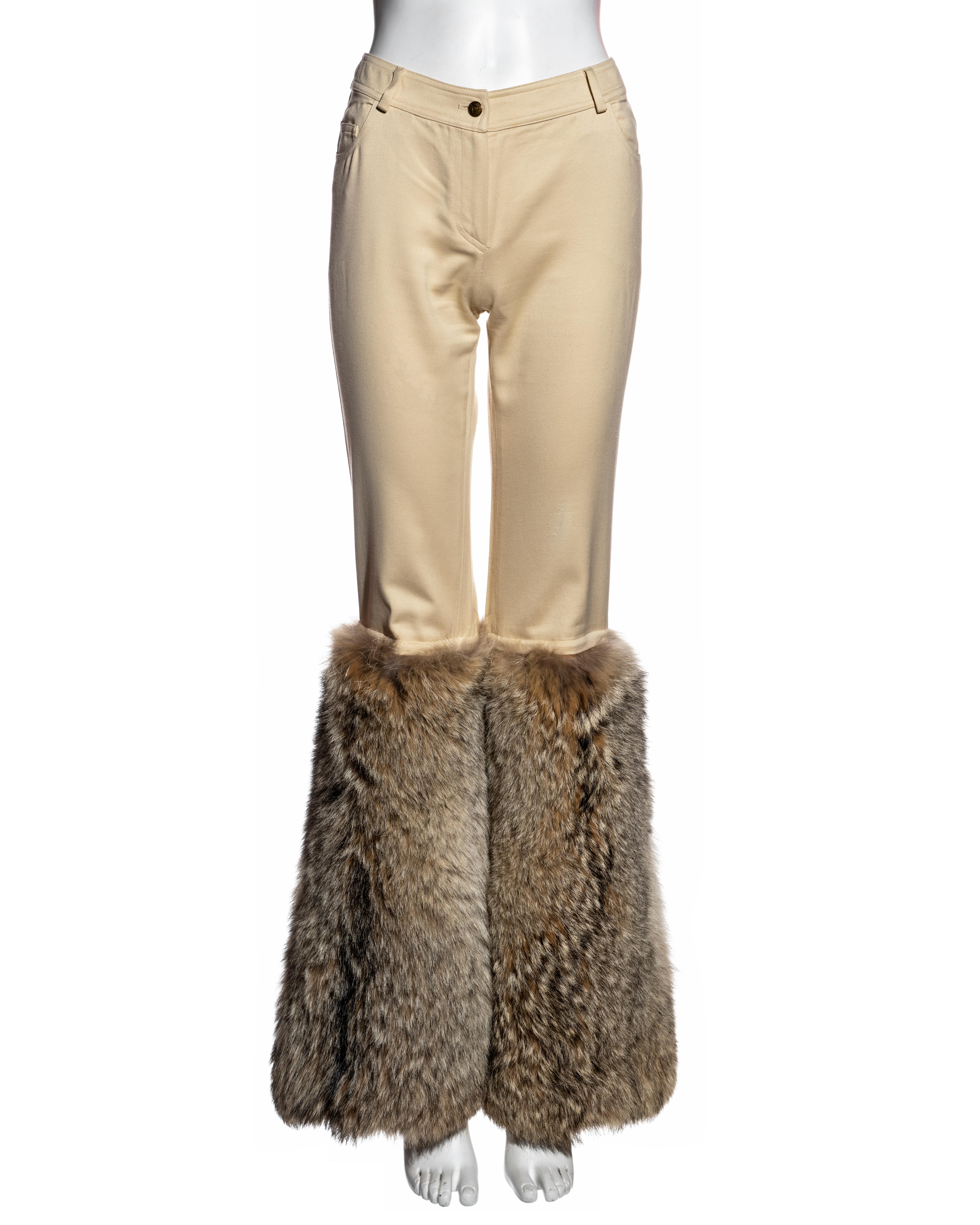 ▪ Christian Dior cream cotton and fur pants 
▪ Designed by John Galliano 
▪ Cream cotton canvas 
▪ Slim-fit 
▪ Oversized Coyote fur panels 
▪ FR 38 - UK 10 - US 6 (runs small)
▪ Fall-Winter 2002
▪ 100% Cotton, 100% Coyote 
▪ Matching Coyote fur