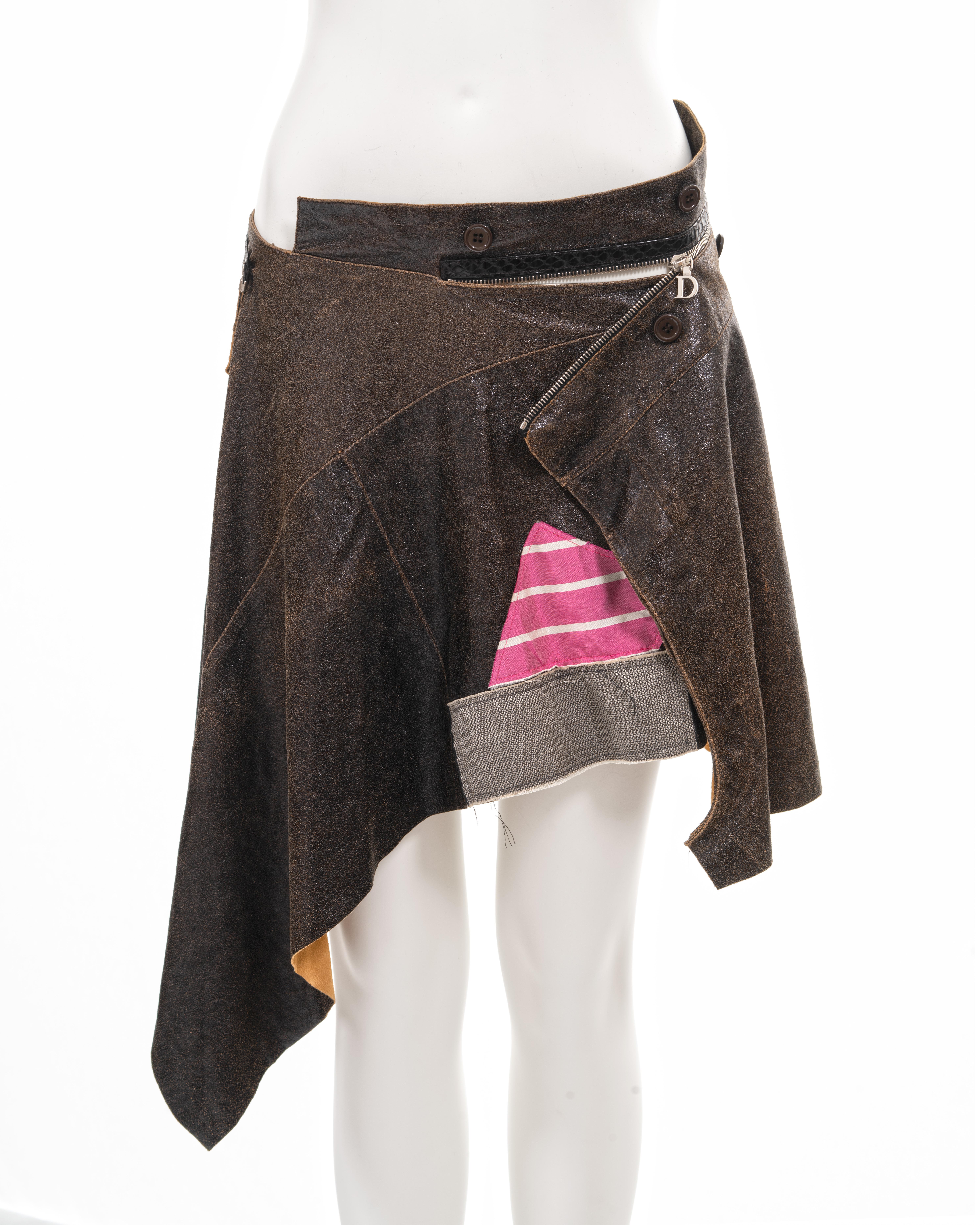 ▪ Christian Dior deconstructed leather wrap skirt 
▪ Creative Director: John Galliano
▪ Spring-Summer 2001 
▪ Constructed from brown distressed leather 
▪ Convertible zipper with Dior 'D' zip pull 
▪ Black snakeskin trim 
▪ Assortment of square