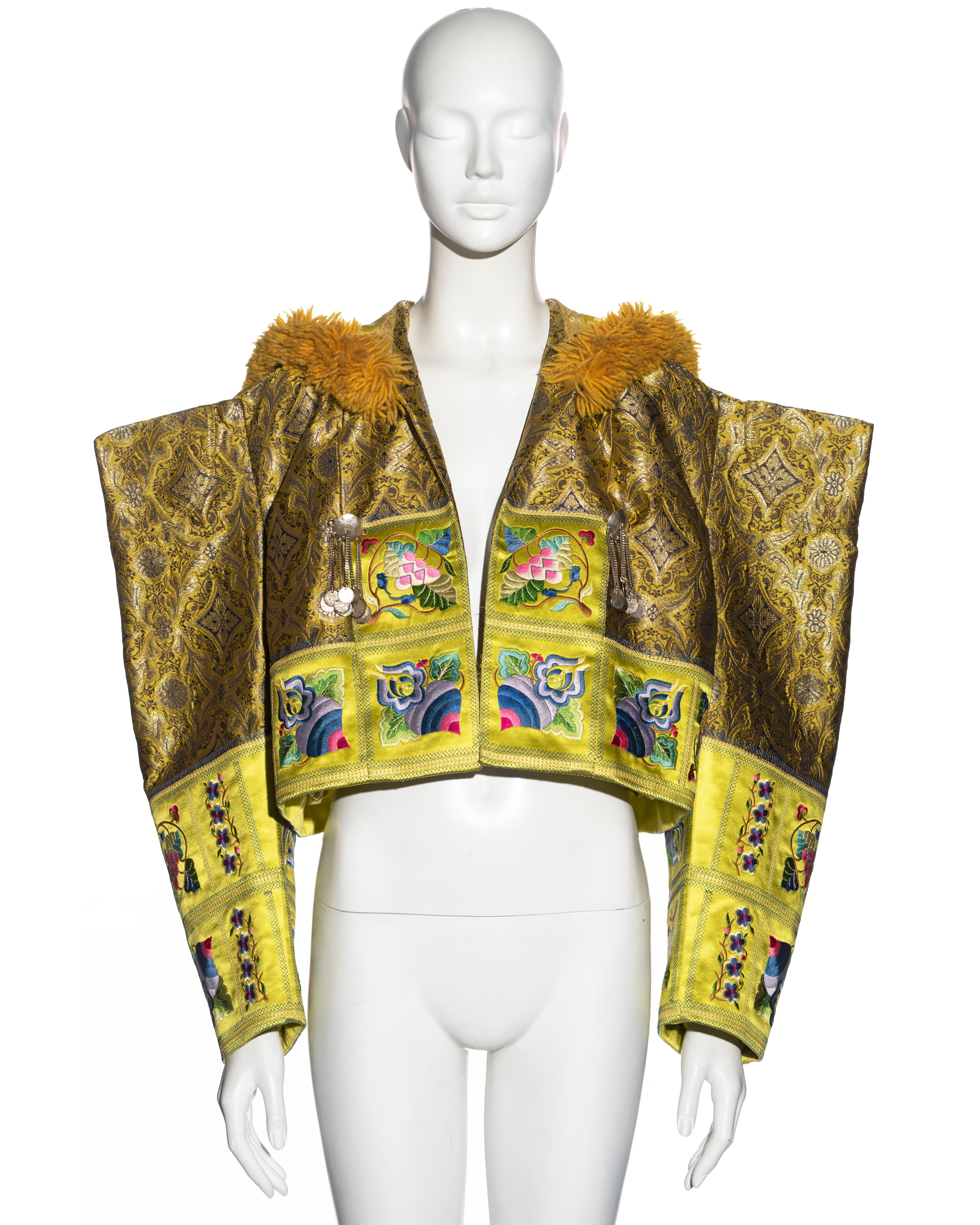 ▪ Christian Dior rare showpiece evening jacket 
▪ Designed by John Galliano
▪ Sold by One of a Kind Archive
▪ Constructed from metallic gold silk brocade 
▪ Chartreuse silk trim with large embroidered patterns 
▪ 2 aged-silver pendent brooches 
▪