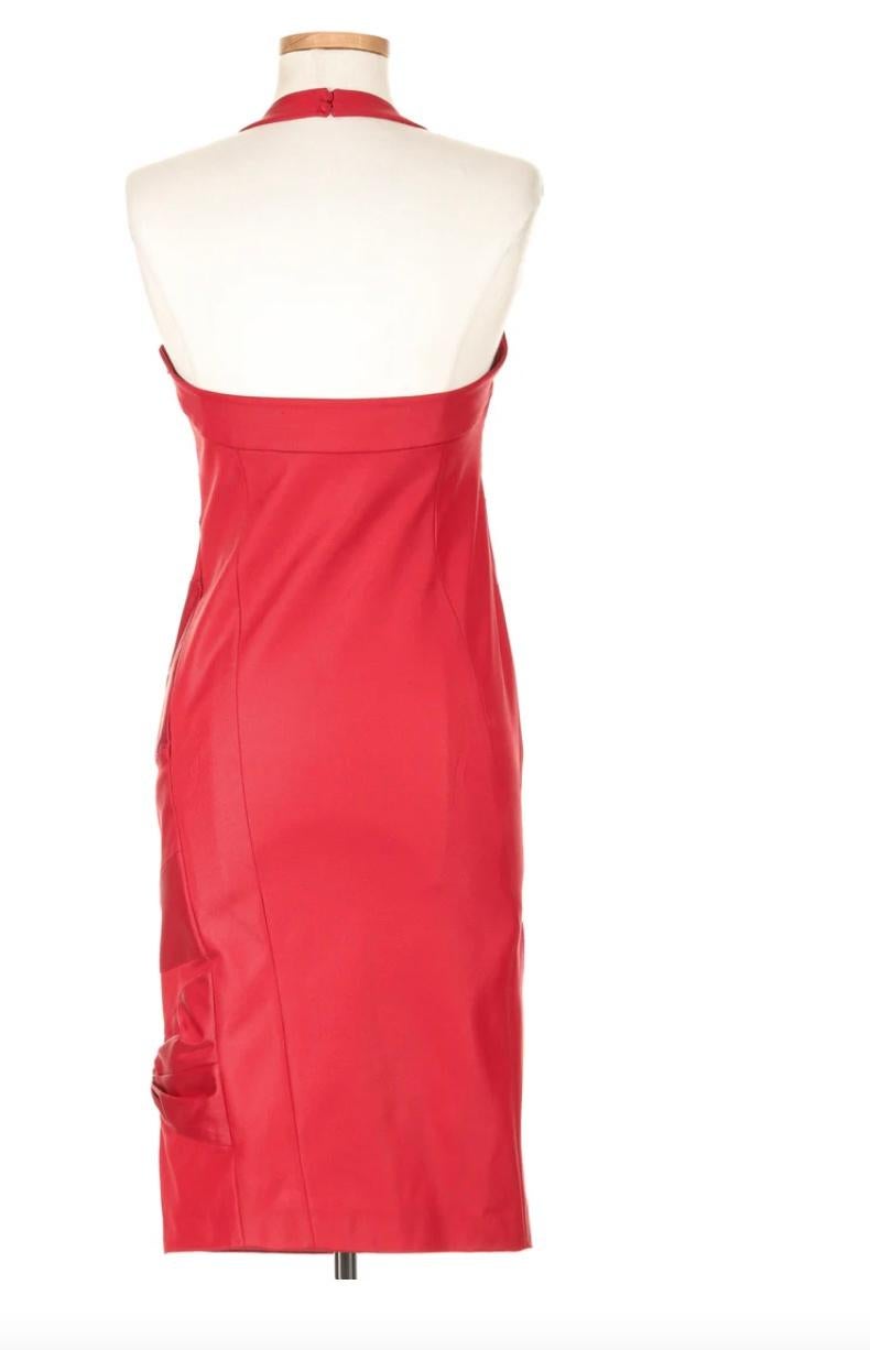 VINTAGE GRACE NY

This bold red dress from Christian Dior’s Fall 2003 runway, crafted by John Galliano, captures his signature dramatic style. With a halter neckline and a form-fitting silhouette, it’s designed to make a powerful statement. The