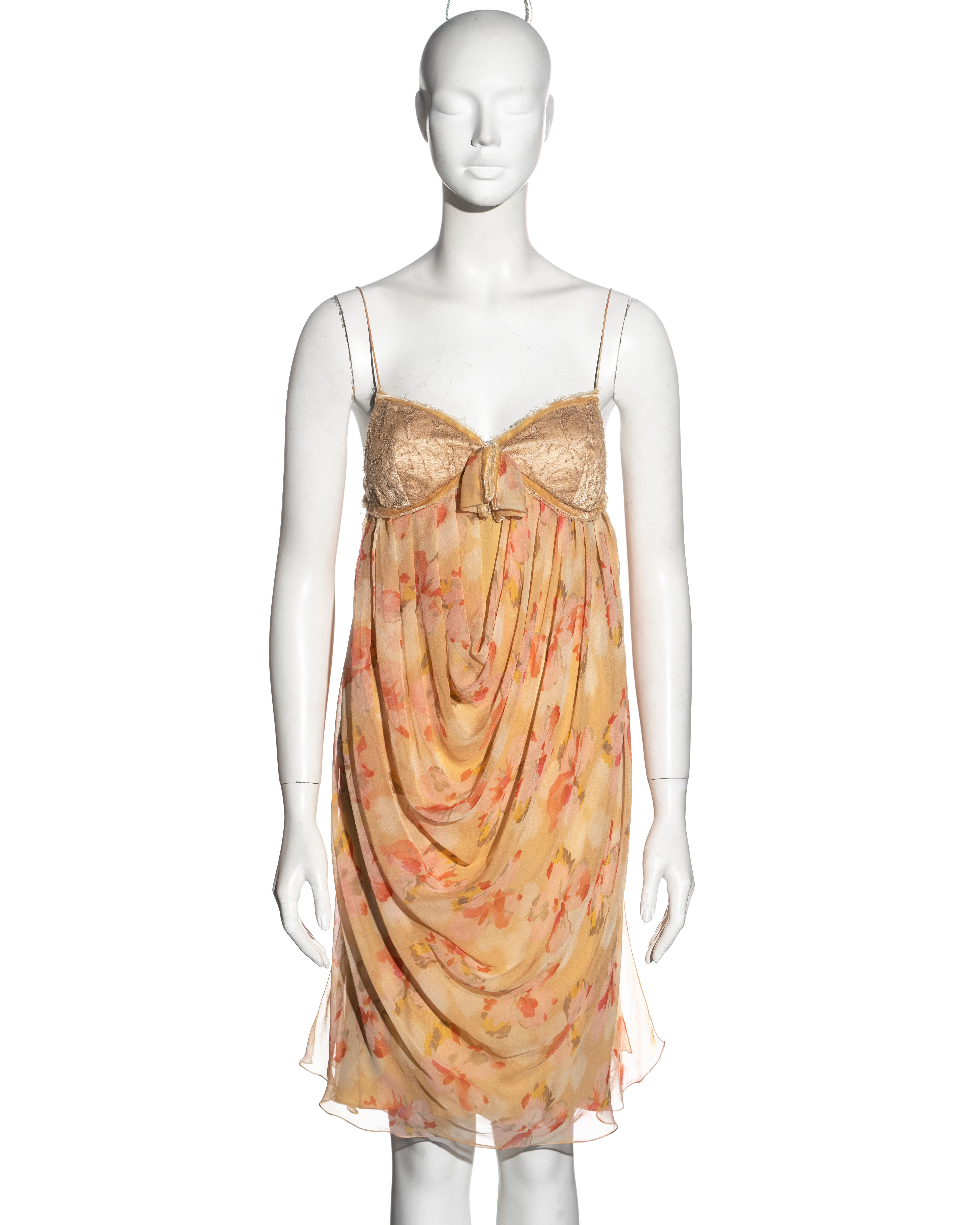 ▪ Christian Dior dress
▪ Designed by John Galliano
▪ Apricot floral printed silk chiffon 
▪ Velvet trim 
▪ Lace bust 
▪ Draped skirt 
▪ Spaghetti straps
▪ Fabric buttons at the side opening 
▪ Silk lining 
▪ FR 40 - UK 12 - US 8
▪ Fall-Winter 2005
▪