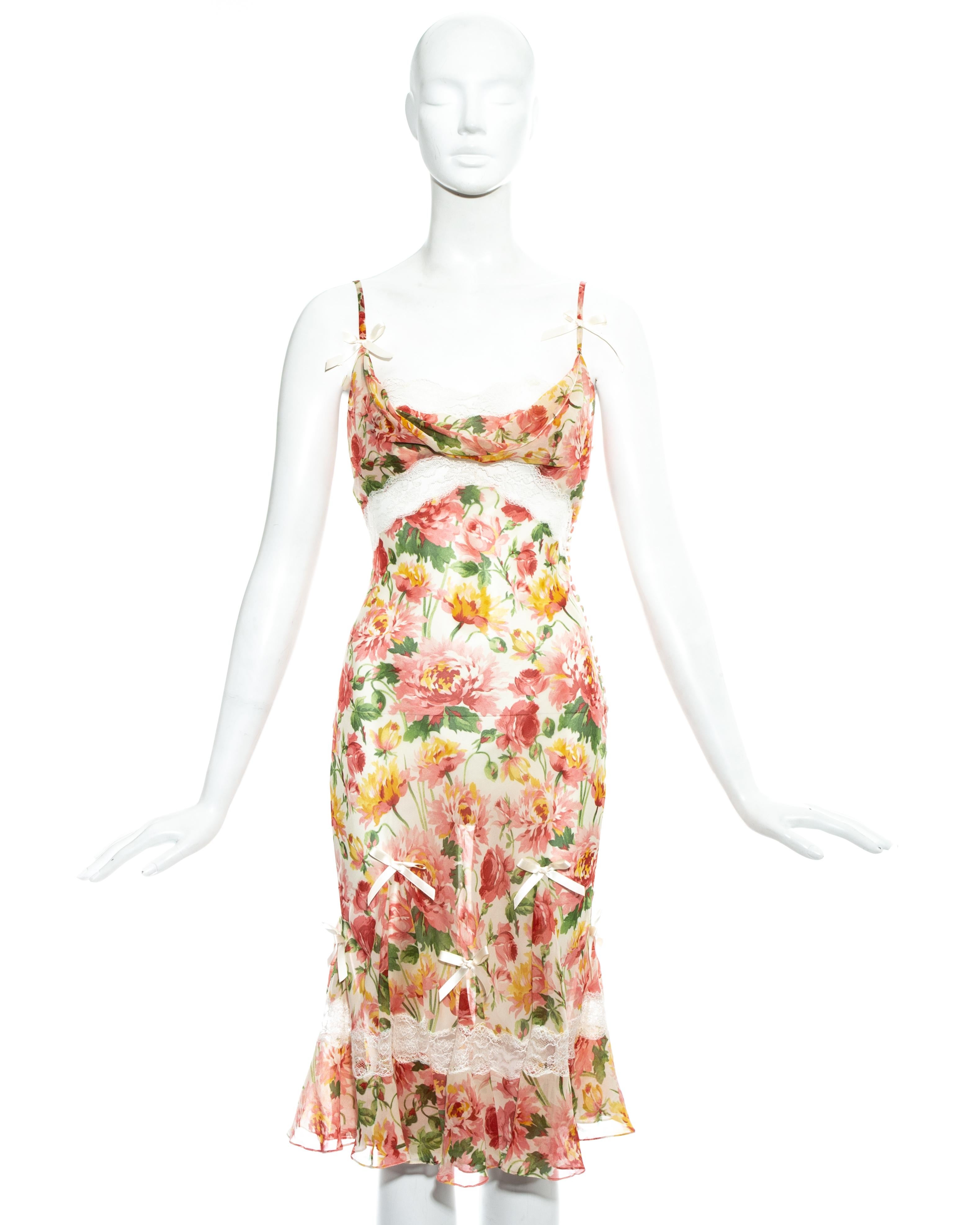 Christian Dior by John Galliano; floral silk chiffon and lace mid-length bias cut dress. 

- White lace inserts and trim
- Decorative silk ribbon bows 
- 27 fabric button fastenings on side seam 
- Sold with optional slip dress 

Spring-Summer 2005