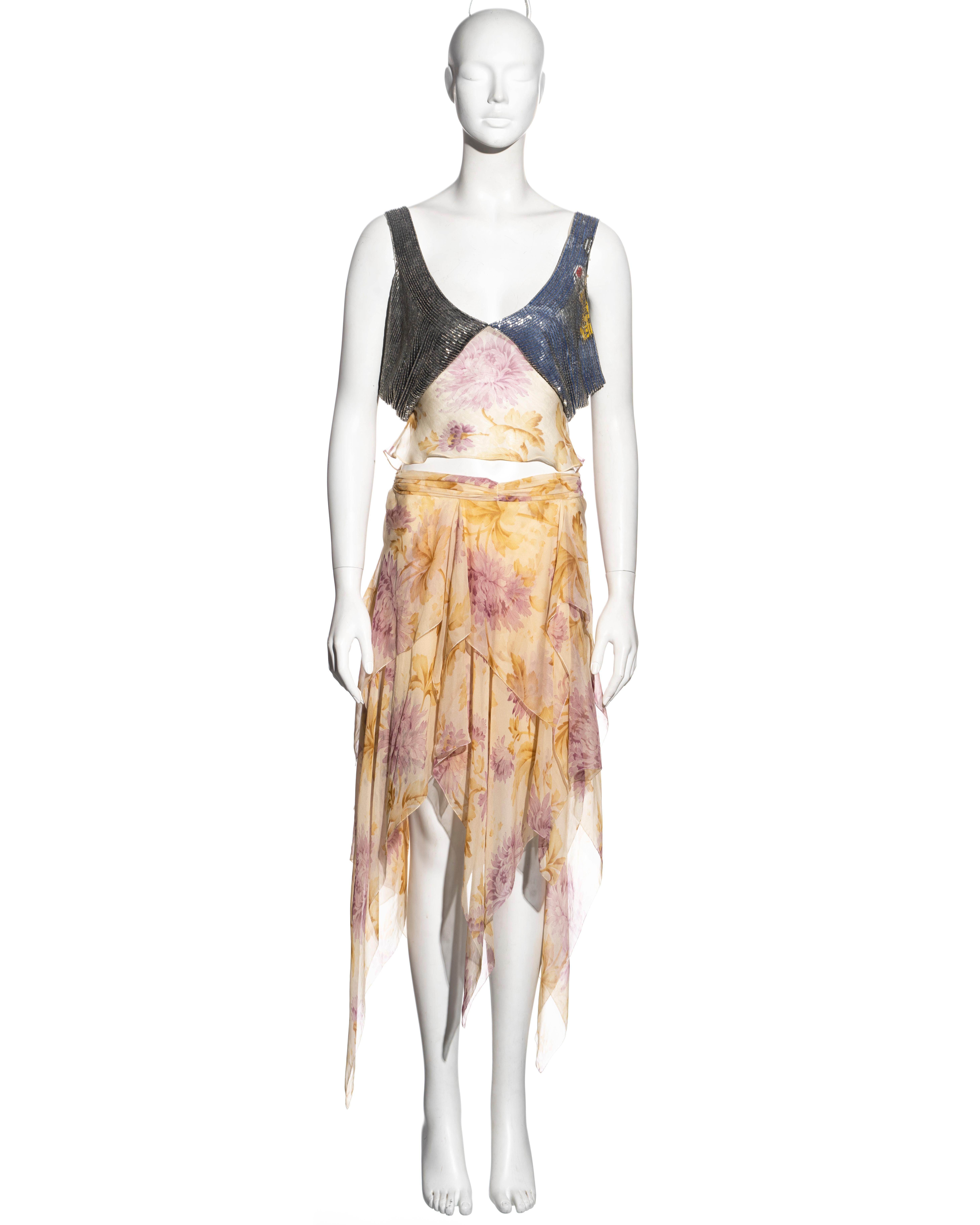 ▪ Christian Dior top and skirt set
▪ Designed by John Galliano
▪ Floral printed silk chiffon in shades of cream, pink and brown
▪ Top with bugle beads sewn over denim-printed silk 
▪ Matching multi-layered skirt with handkerchief hem 
▪ Top: FR 40 -