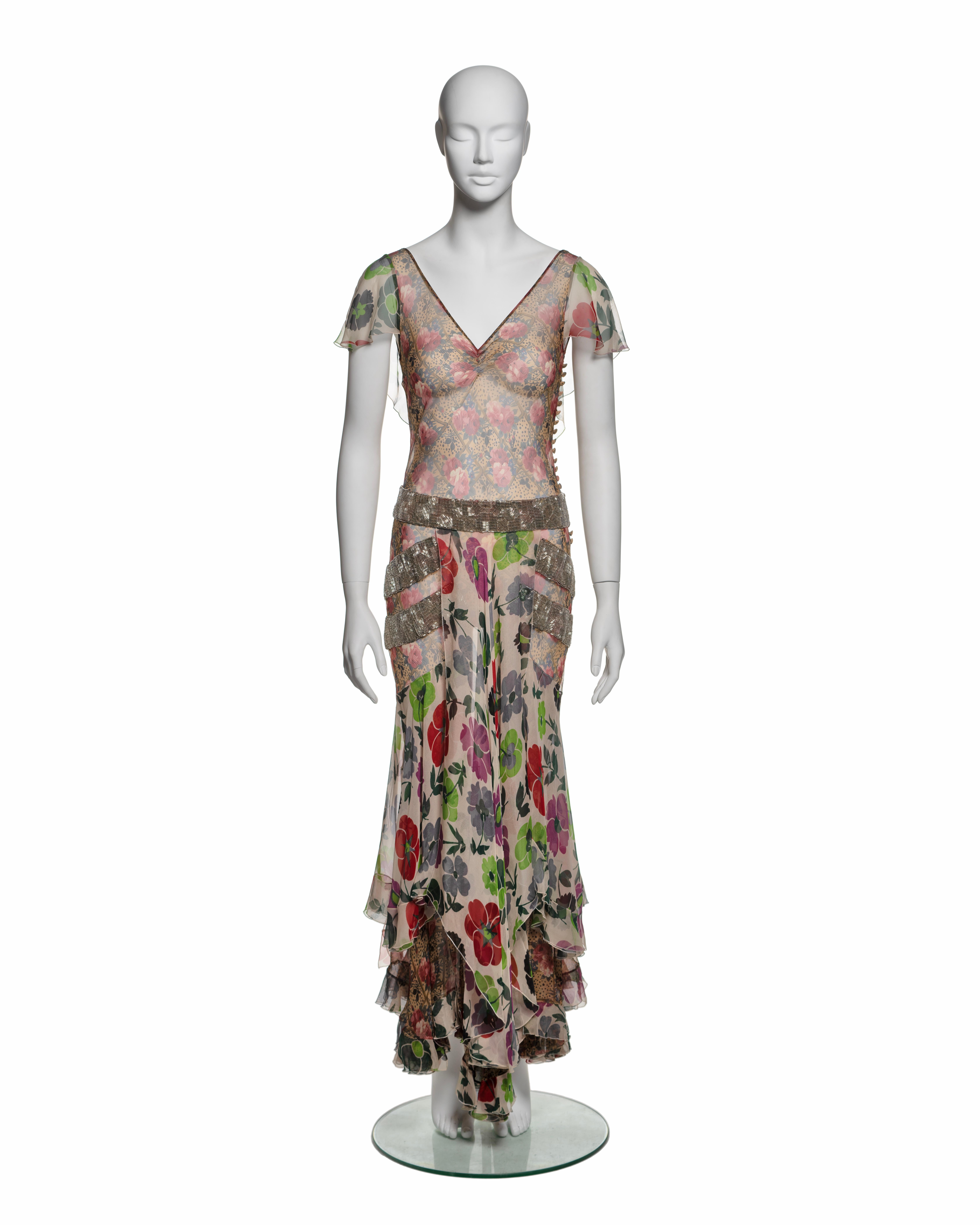This rare Christian Dior dress from the Fall-Winter 2001 collection features a bias-cut silk chiffon construction and includes a coordinating nude slip dress for optional coverage. The dress presents a V-neck bodice with sheer short flutter sleeves