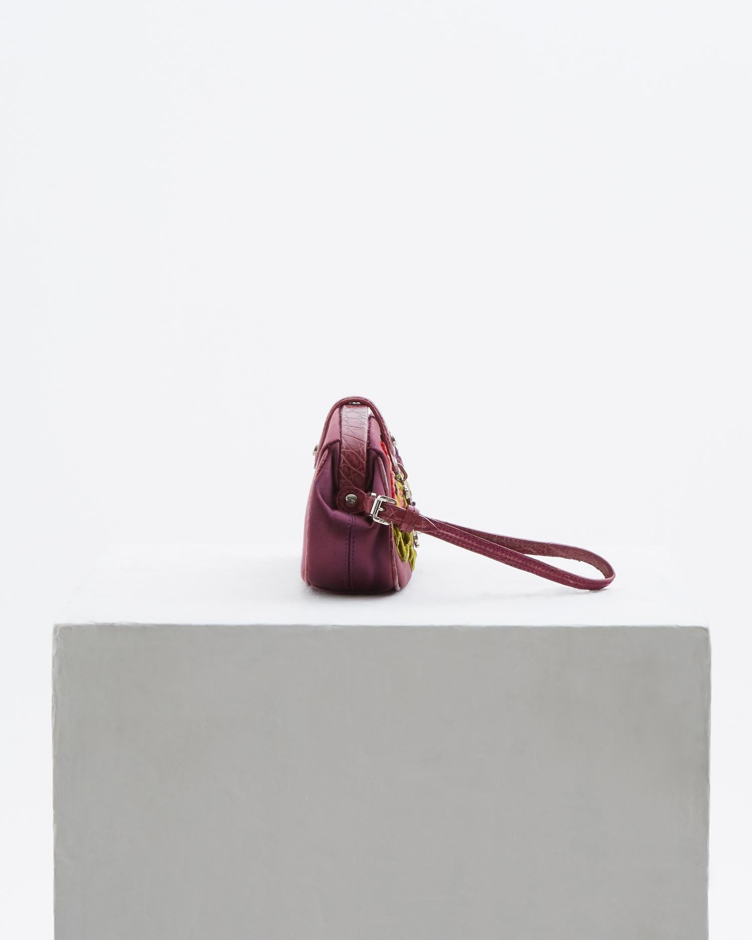 - Designed by John Galliano 
- Sold by Skof.Archive 
- Limited Edition, n. 088 
- Velvet embroidered floral motifs 
- Croco trim satin clutch 
- Spring Summer 2005 
- Single magnetic snap closure 
- Comes with dust bag

Conditions: