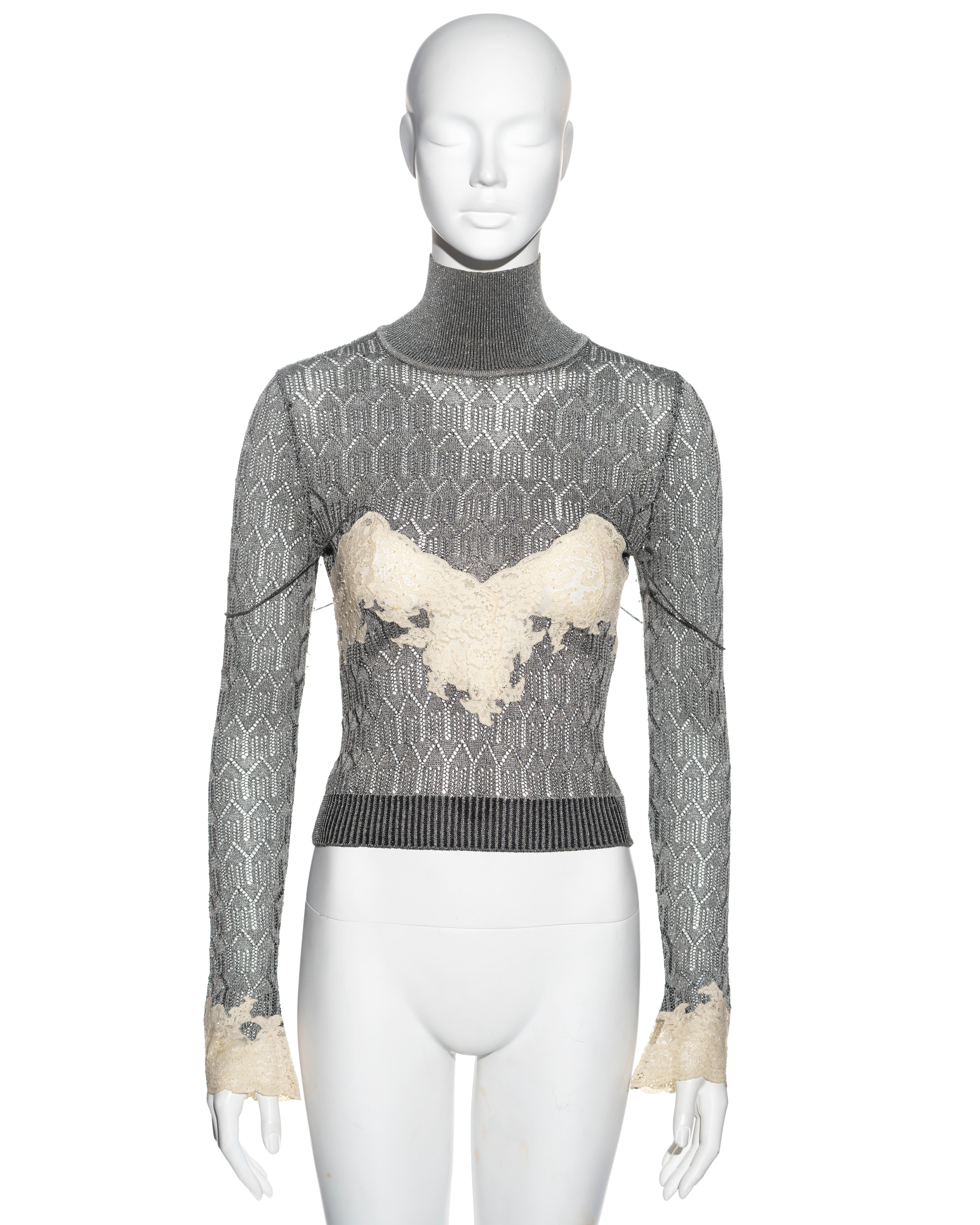 ▪ Christian Dior sweater
▪ Sold by One of a Kind Archive
▪ Constructed from silver foiled knitted viscose 
▪ Cream Chantilly lace inserts 
▪ Turtle neck 
▪ Spaghetti straps 
▪ Size Small
▪ Fall-Winter 1998
▪ Made in France

All photographs in this