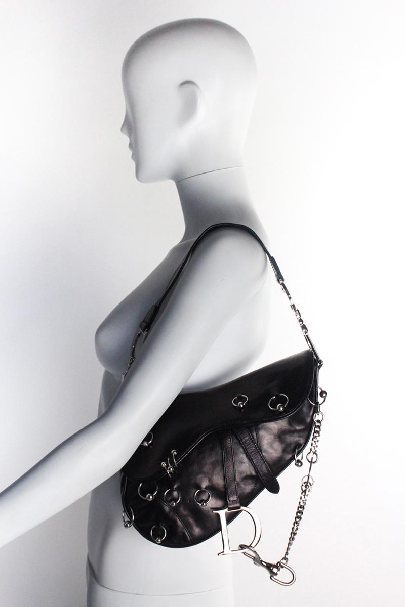 Rare vintage Christian Dior saddle bag, limited 'Hardcore' edition designed by John Galliano. As seen on Gisele Bündchen, who was photographed by Nick Knight wearing it for the Spring/Summer 2004 Dior campaign. Black leather with silver toned
