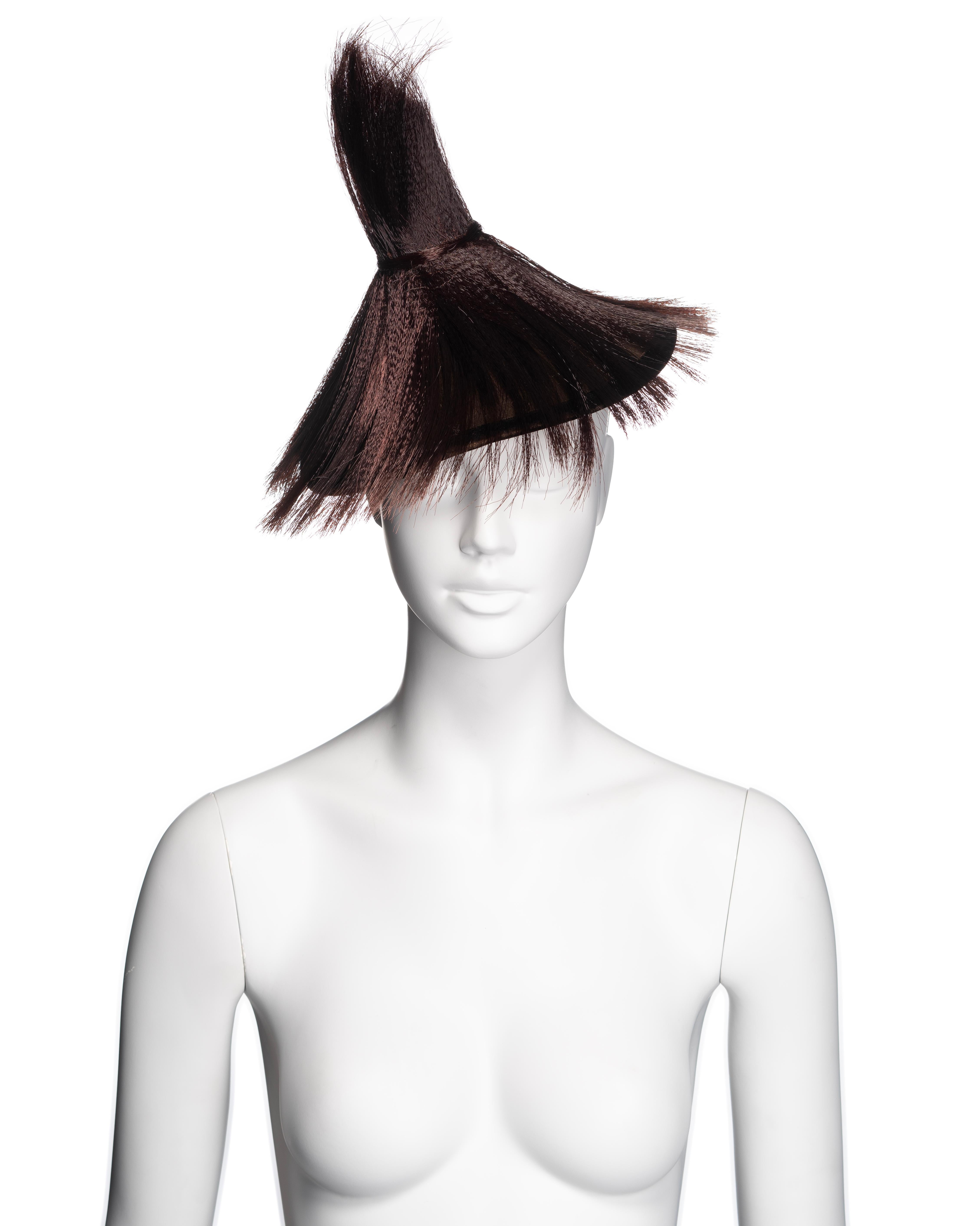 ▪ Brand: Christian Dior
▪ Creative Director: John Galliano
▪ Collection: Fall-Winter 2007
▪ Fabric:  Horse Hair, Wool Felt, Velvet 
▪ Details: A rare runway prototype, this conical brown wool felt fascinator with a velvet trim and adorned with