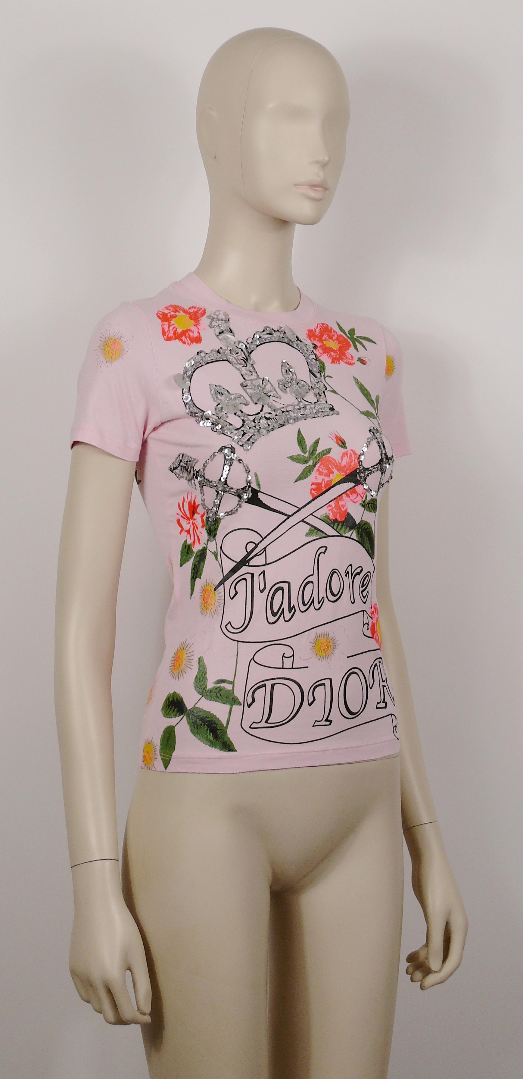 CHRISTIAN DIOR by JOHN GALLIANO J'ADORE DIOR short-sleeve pink top featuring a crown and crossed swords embellished with silver toned sequins, multicolored floral print.

Label reads CHRISTIAN DIOR BOUTIQUE Paris.
Made in France.

Size tag reads : F