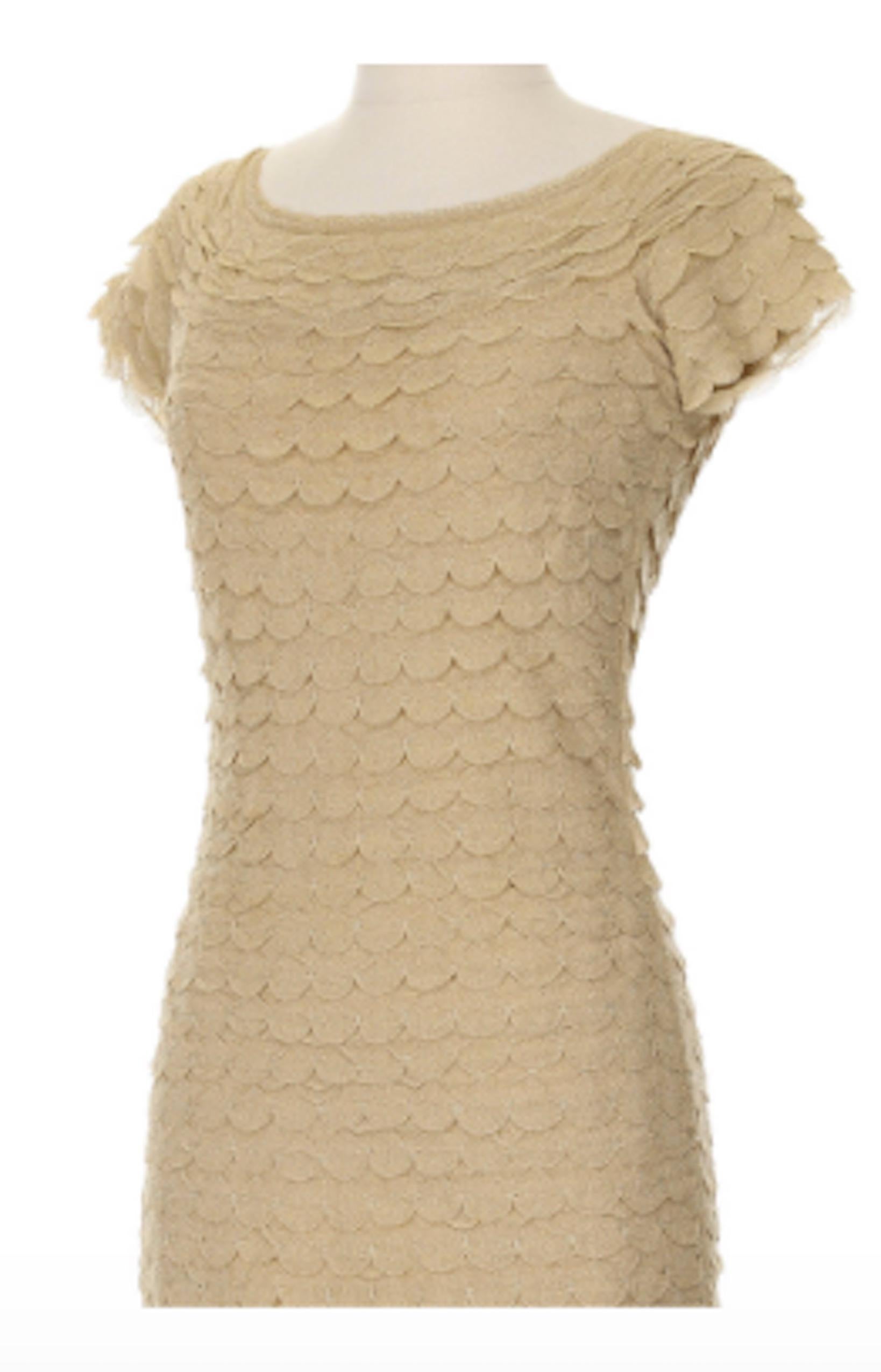 Christian Dior by John Galliano Gold Knit Scalloped Detail Mini Dress, Circa 2000's. Beautiful gold metallic knit mini dress with layered scalloped details. Can be worn on or off the shoulders. A cute little addition to your wardrobe that hugs the
