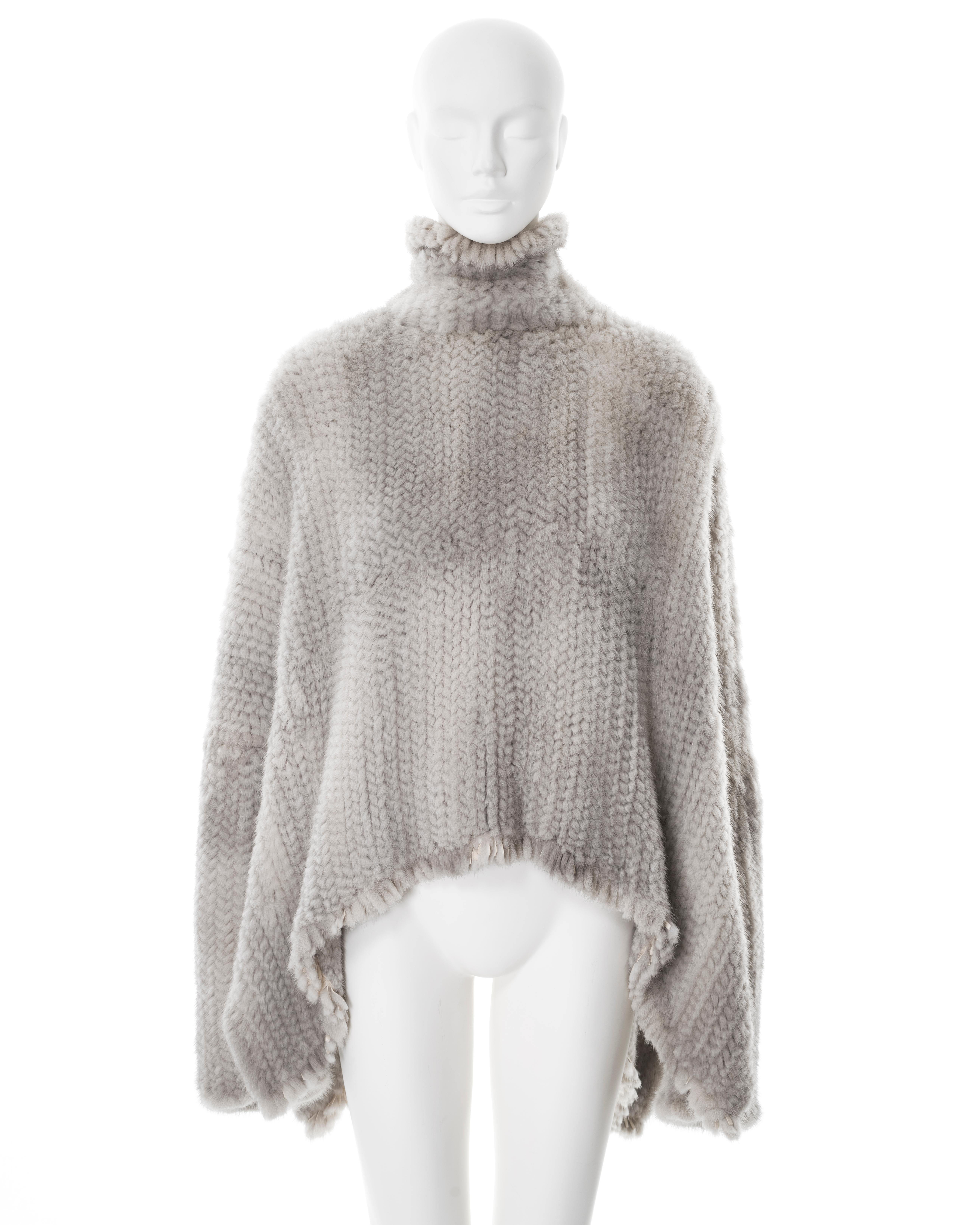 ▪ Christian Dior fur sweater
▪ Creative Director: John Galliano
▪ Sold by One of a Kind Archive
▪ Fall-Winter 2000
▪ Constructed from knitted light grey mink fur 
▪ Wide cut 
▪ Oversized fit 
▪ High-low hemline 
▪ Size FR 42 - UK 14 - US 10
▪ Made