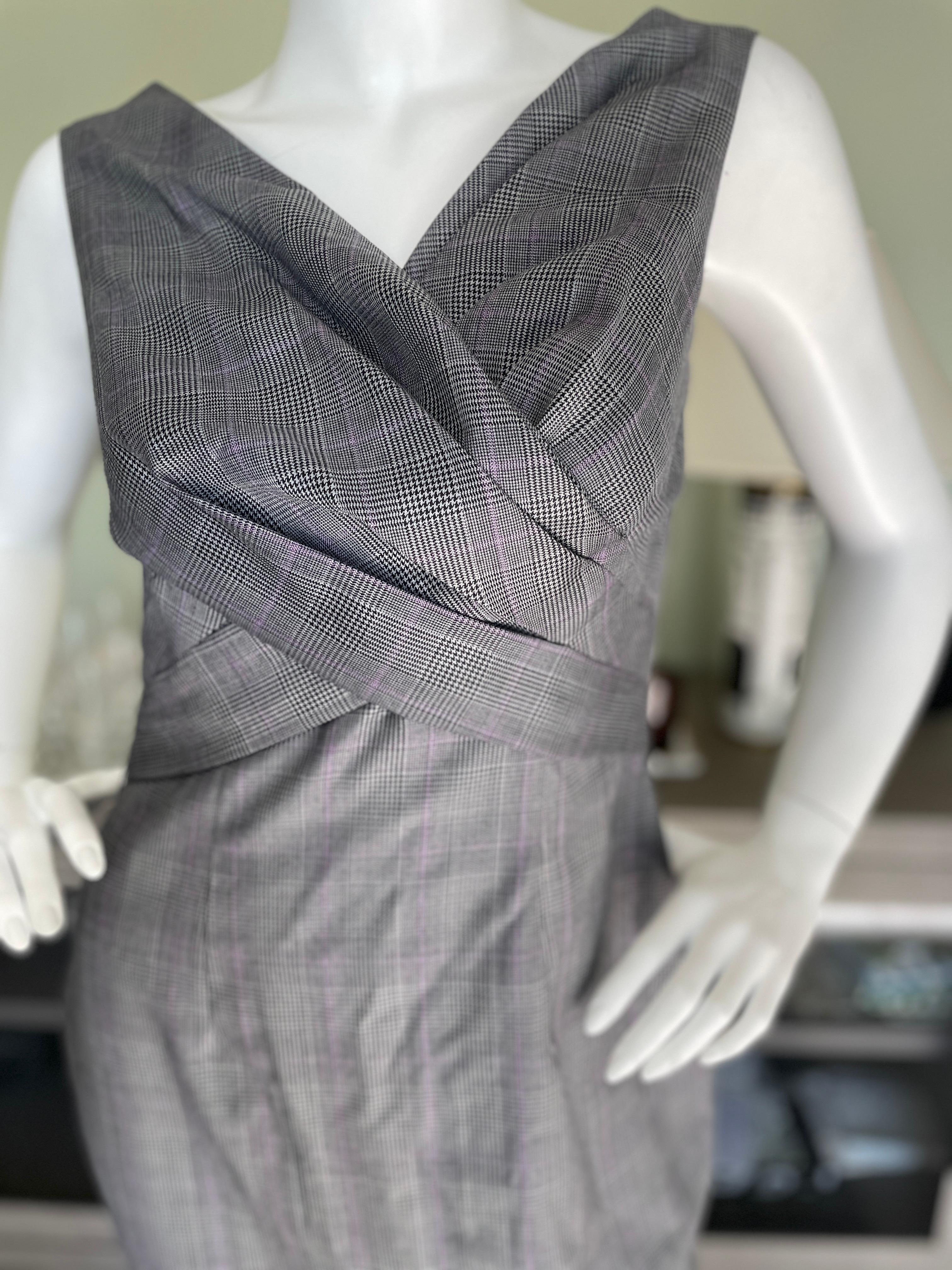 Christian Dior by John Galliano Lightweight Prince of Wales Plaid Day Dress.
Lined in silk, this is much prettier in person.
Size 40
  Bust 36