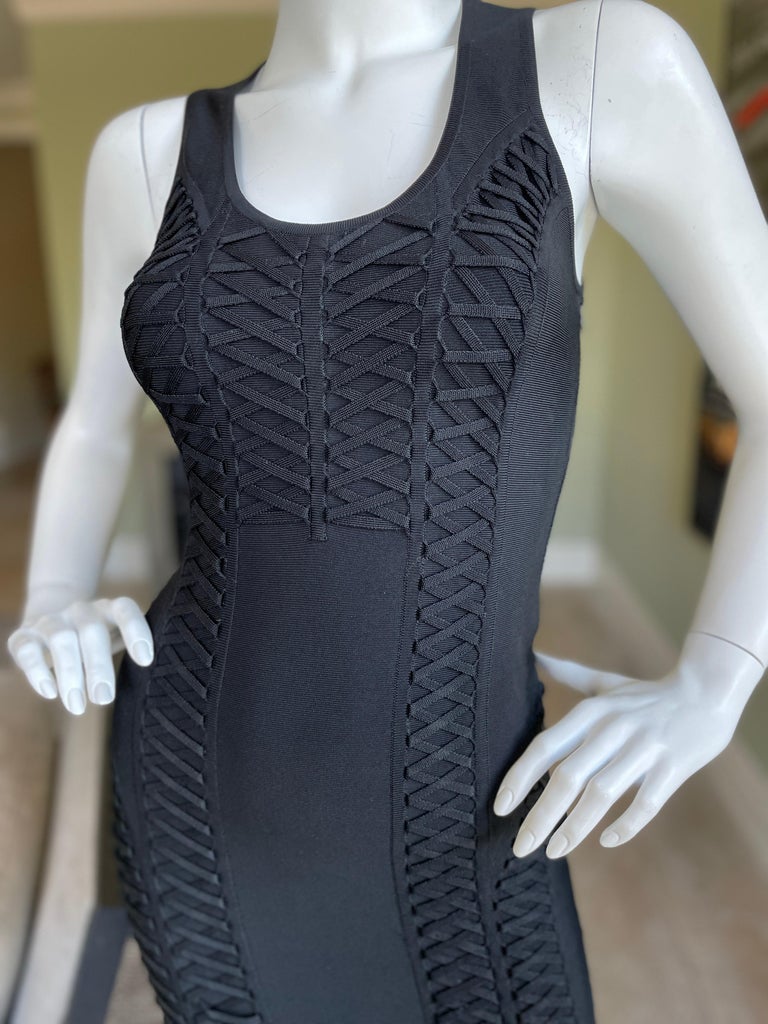 Christian Dior by John Galliano Little Black Dress with Corset Lacing Details.
This is so special.
Use the zoom feature to see details.
There is a lot of stretch in this, the measurements are given lying flat, with out stretching.
Size 38
  Bust
