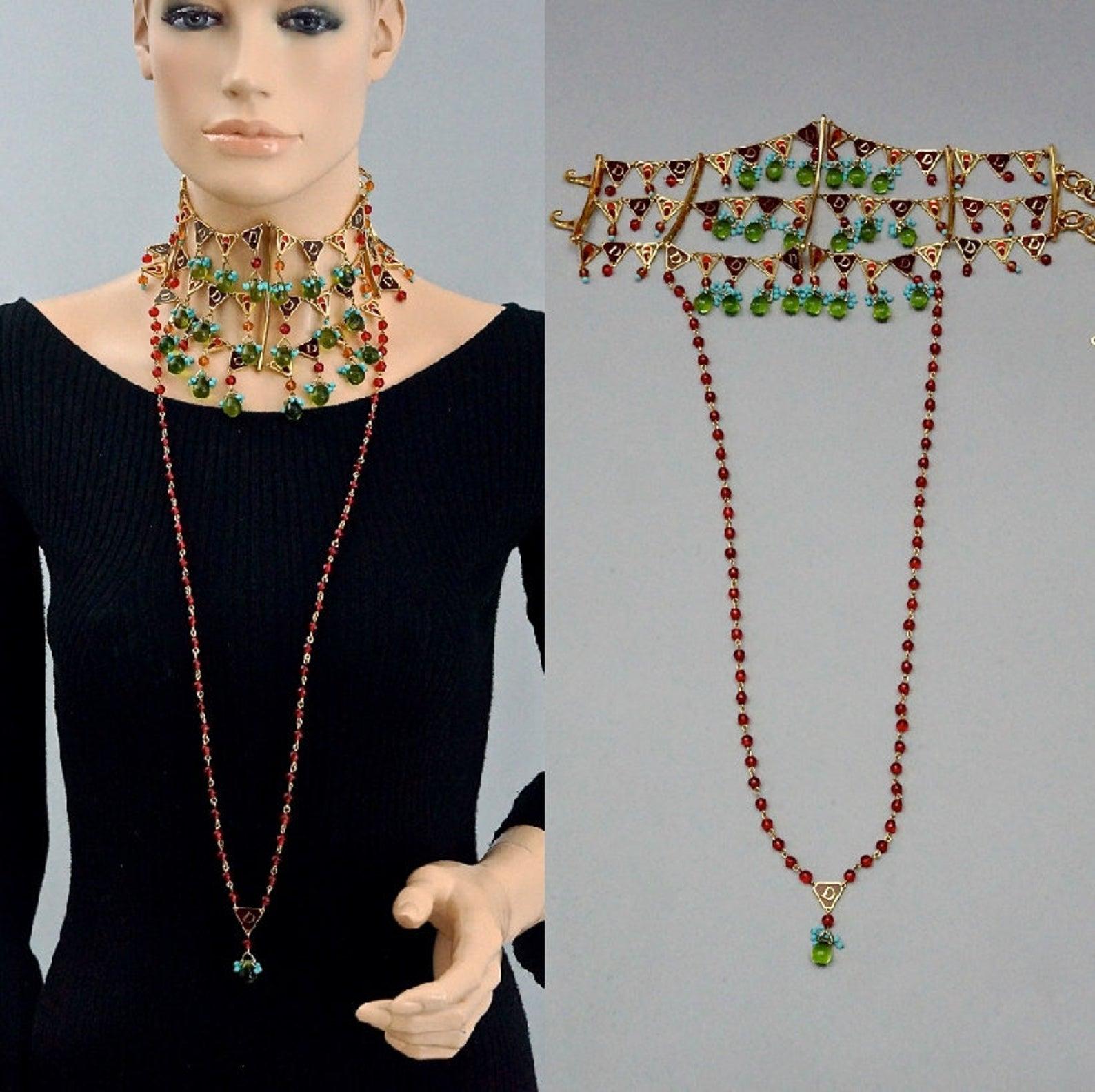 CHRISTIAN DIOR by John Galliano Maasai Poured Glass Choker Necklace

MEASUREMENTS:
Height: 4.92 inches (12.5 cm)
Length of Beaded Strand at the front: 15.94 inches (40.5 cm)
Maximum Wearable Length: 14.76 inches (37.5 cm) adjustable

FEATURES:
-