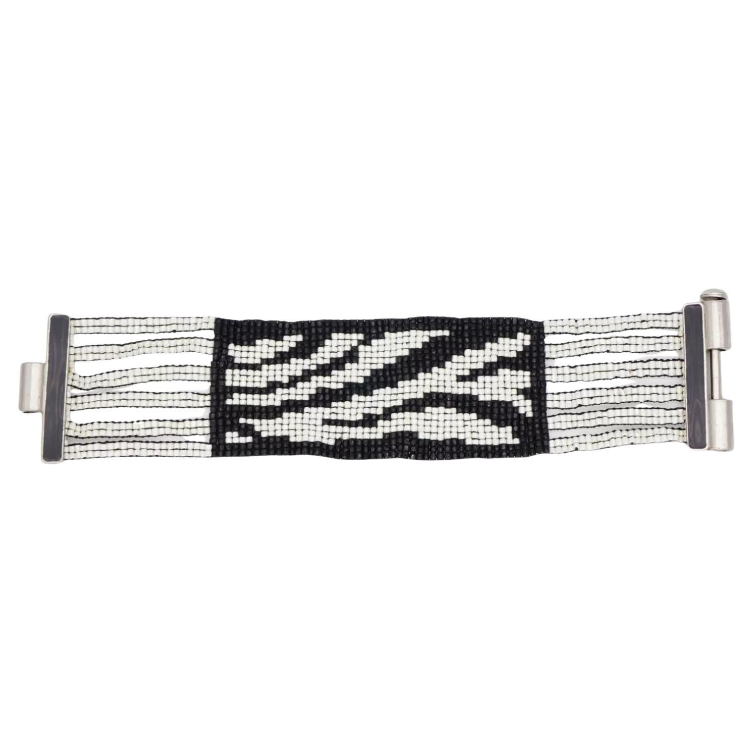Christian Dior by John Galliano Masai 1997 Vintage Micro Beaded Black White Link Six 6 Layers Strands Openwork Interlink Bracelet, Silver Plated

Very excellent condition. Very rare to find. 100% Genuine. Marked at closure. Very rare to