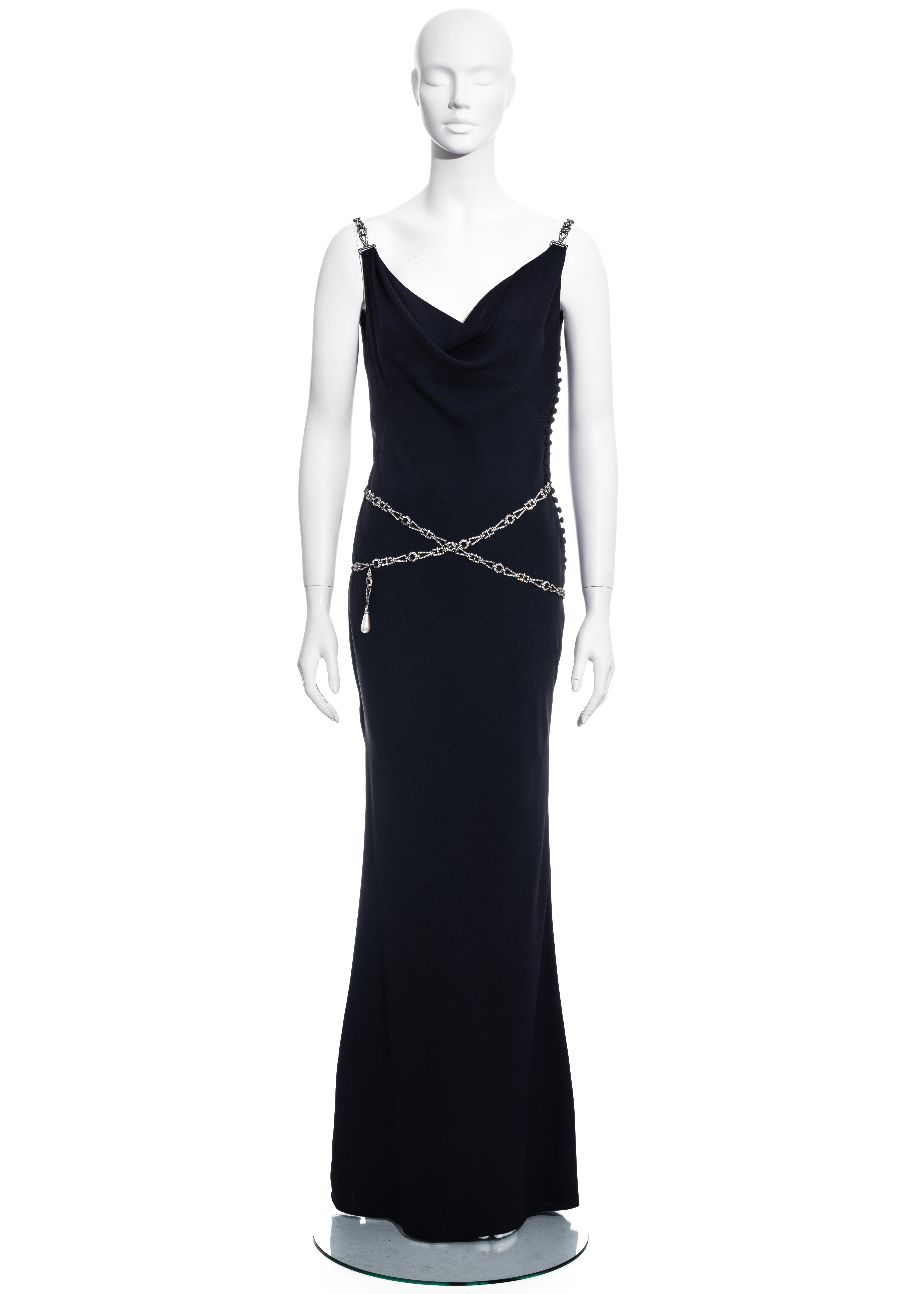 ▪ Christian Dior midnight blue evening dress
▪ Designed by John Galliano
▪ 68% Acetate, 32% Viscose 
▪ Cowl neckline
▪ Low back
▪ Fabric covered button fastenings 
▪ Chained shoulder straps belt with crystals and pearl
▪ FR 42 - UK 14 - US 10 
▪