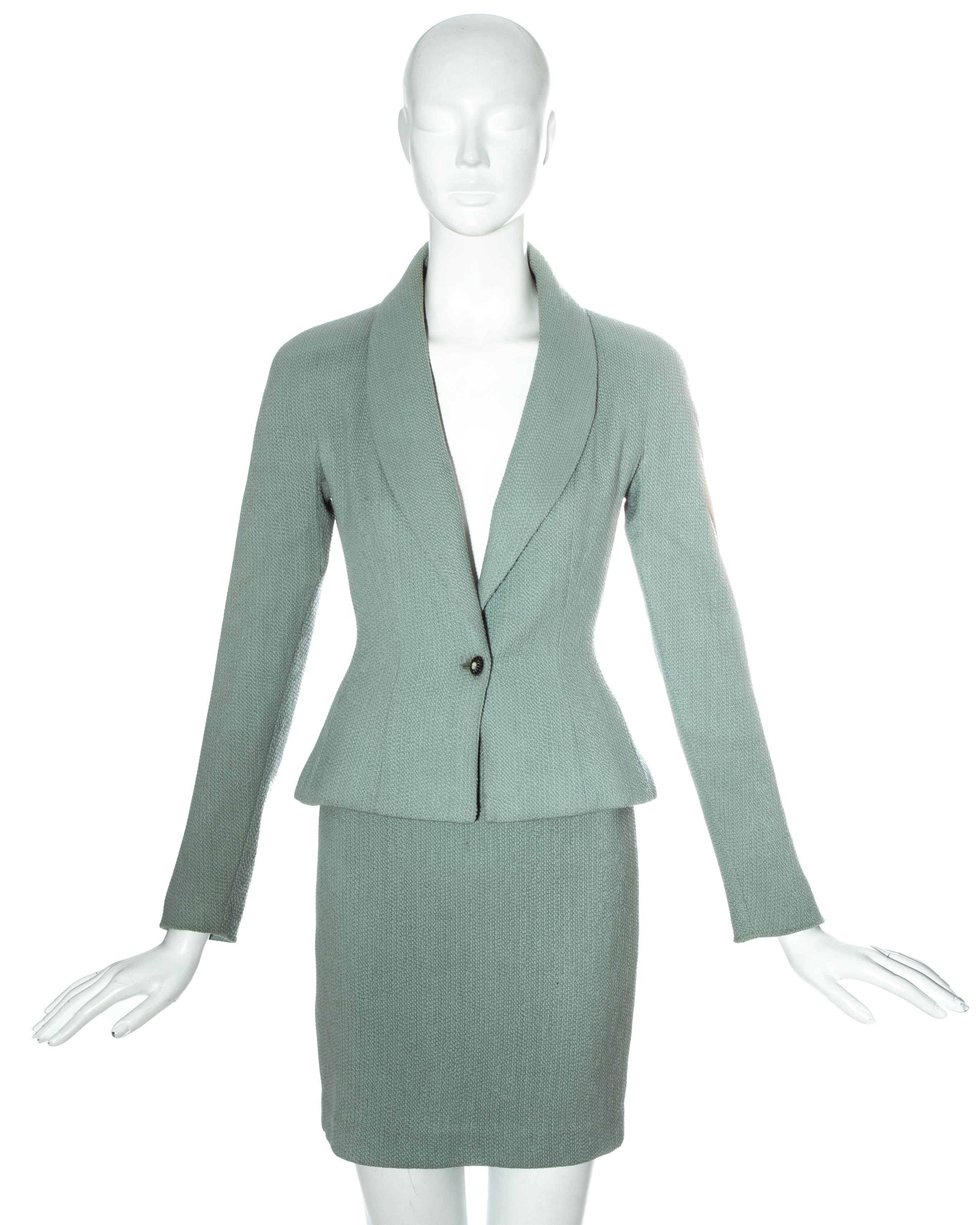 Christian Dior by John Galliano mint green wool skirt suit comprising: tailored jacket with accentuated waistline, shawl lapel, antique style cameo button fastening, embroidered 'CD' silk lining and matching mini skirt. 

Spring-Summer 1998