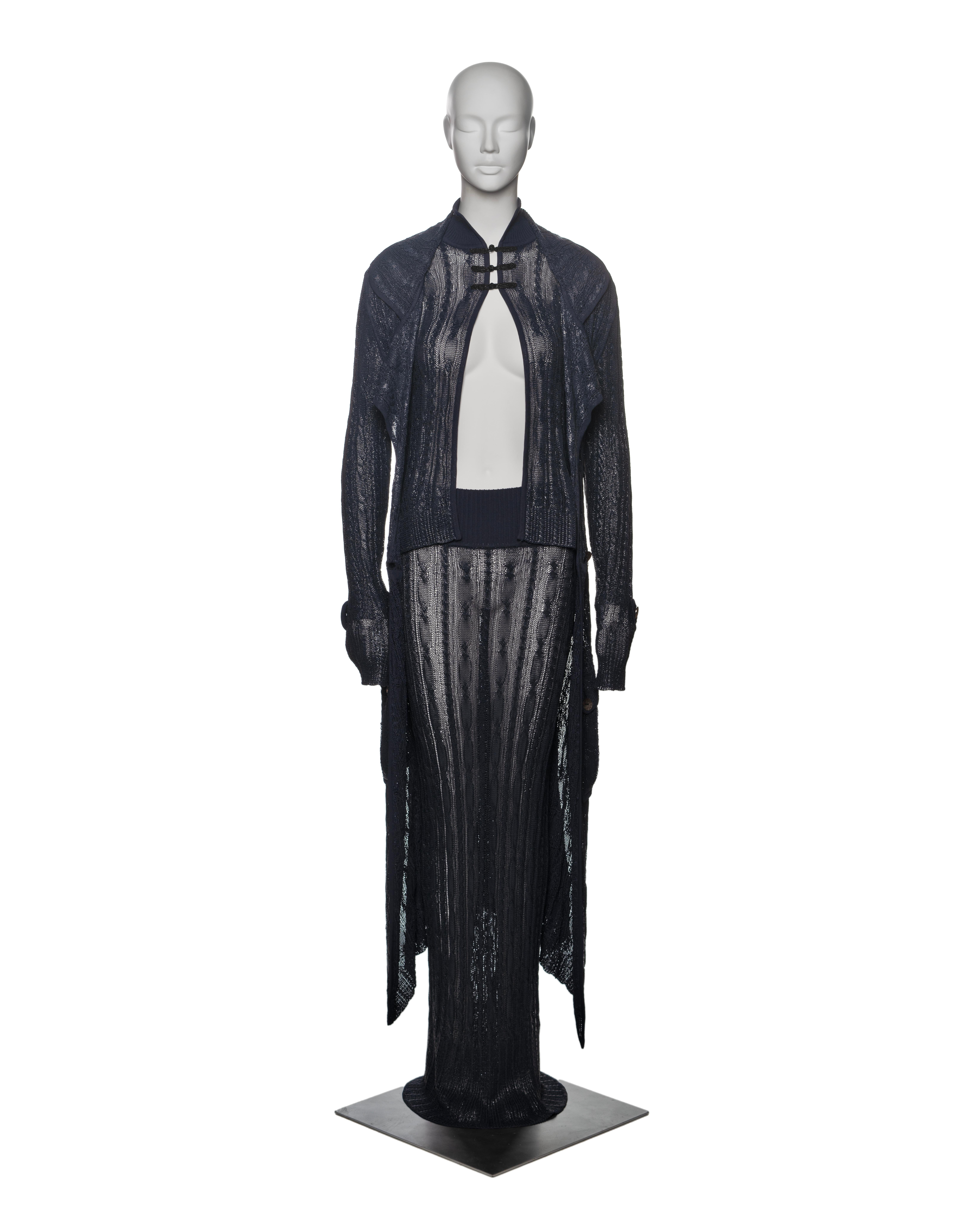 ▪ Brand: Christian Dior
▪ Creative Director: John Galliano
▪ Collection: Spring-Summer 1999
▪ Fabric: Crafted from navy viscose yarn, this pointelle knit features a polyurethane (PU) coating that gives the surface a 'wet-look' finish. The fabric