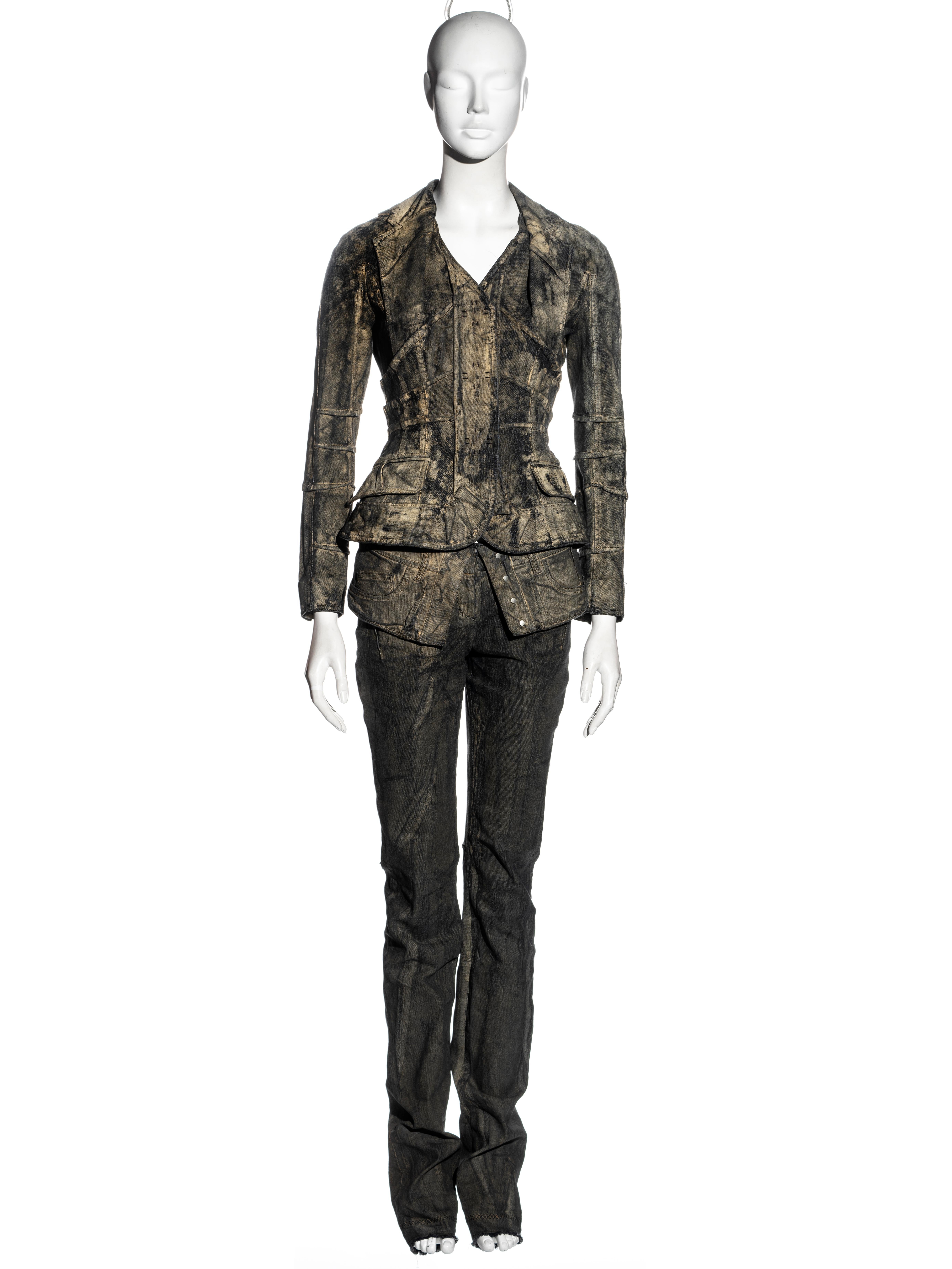 ▪ Christian Dior jacket and pants two-piece suit
▪ Designed by John Galliano
▪ Sand-washed painted denim 
▪ Fitted jacket with inverted darts and halter-neck style lapel 
▪ Large snap button closures 
▪ Extra long slim-fit pants with turn-over waist